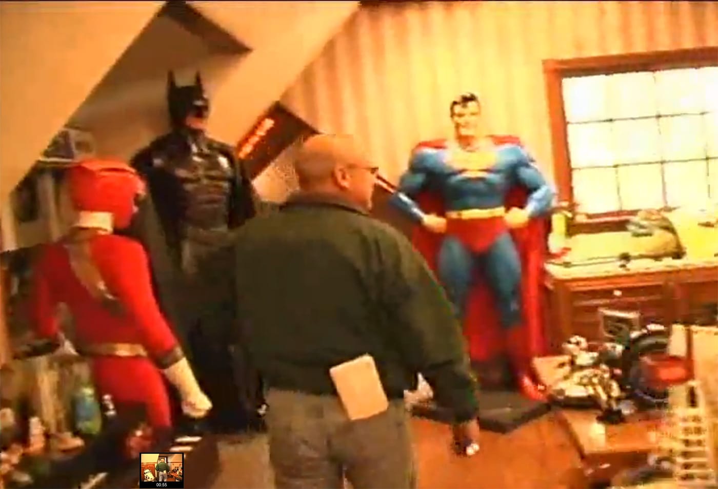 Members of the Santa Barbara Country Sheriff’s Department walking through Michael Jackson's Neverland Ranch during the 2003 police raid. (screenshot by the author)