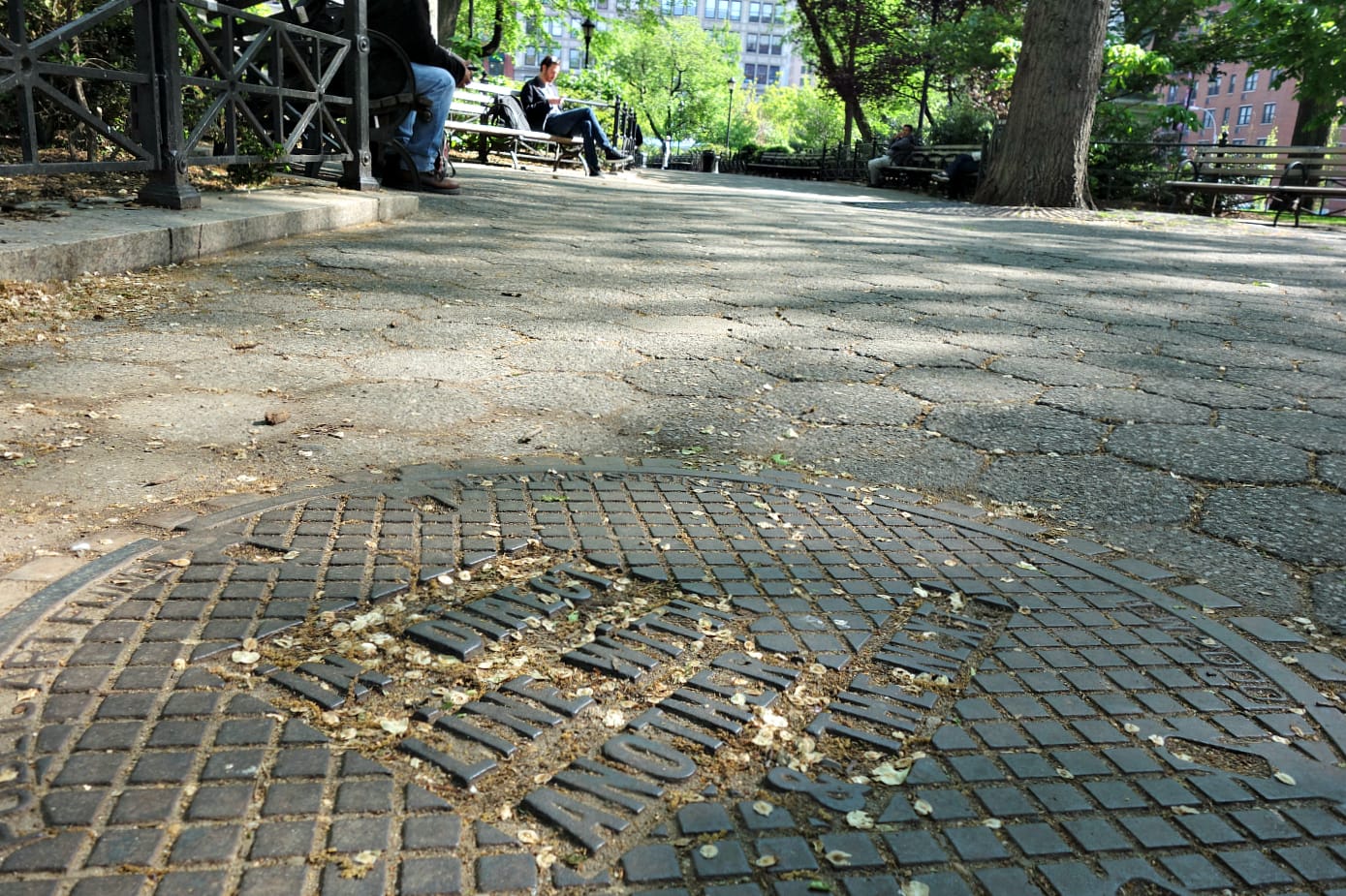 Manhole cover designed by Lawrence Weiner in Union Square (all photos by the author for Hyperallergic)