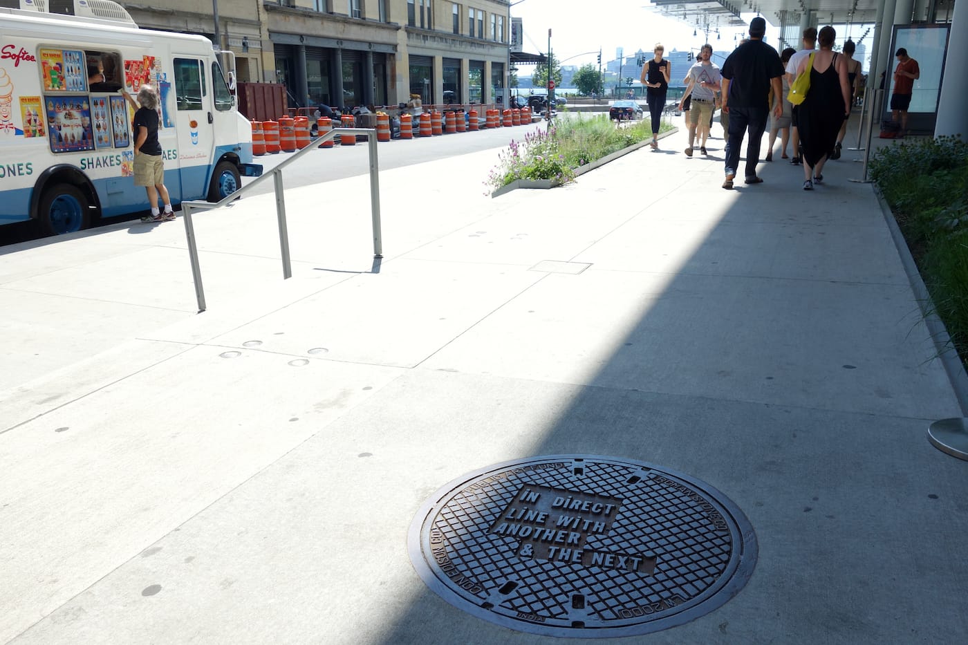 Manhole cover designed by Lawrence Weiner outside the Whitney Museum of American Art