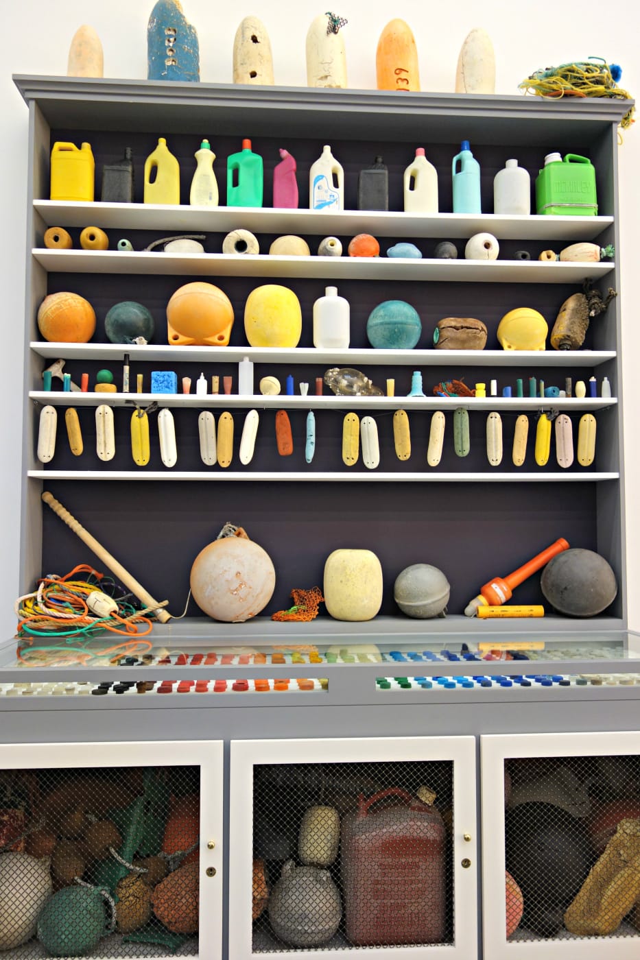 Mark Dion, "Cabinet of Marine Debris" (2014), wood, glass, metal, paint, and assorted marine debris from the North Pacific Gyre, a floating patch of garbage