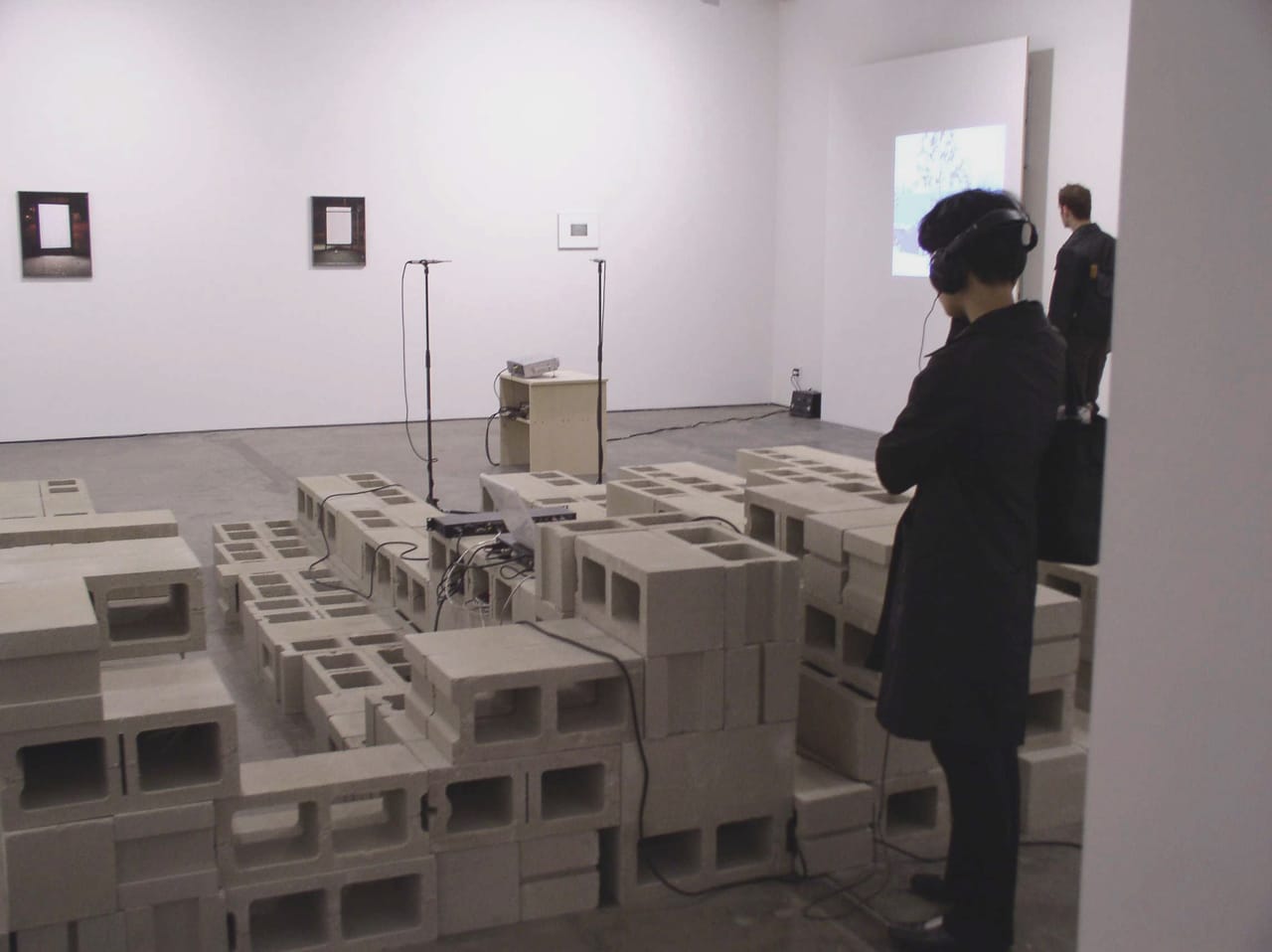 Akiko Ichikawa, installation view of "I Heard the Term Primitive Used, Which I Liked, He Smiles. But You Have to Wait a Month or So for Real Reactions" (2003) at Andrew Kreps Gallery, cement blocks, Motu 828, Mac iBook, and microphones, 18 x 20 x 4 ft (courtesy the artist)