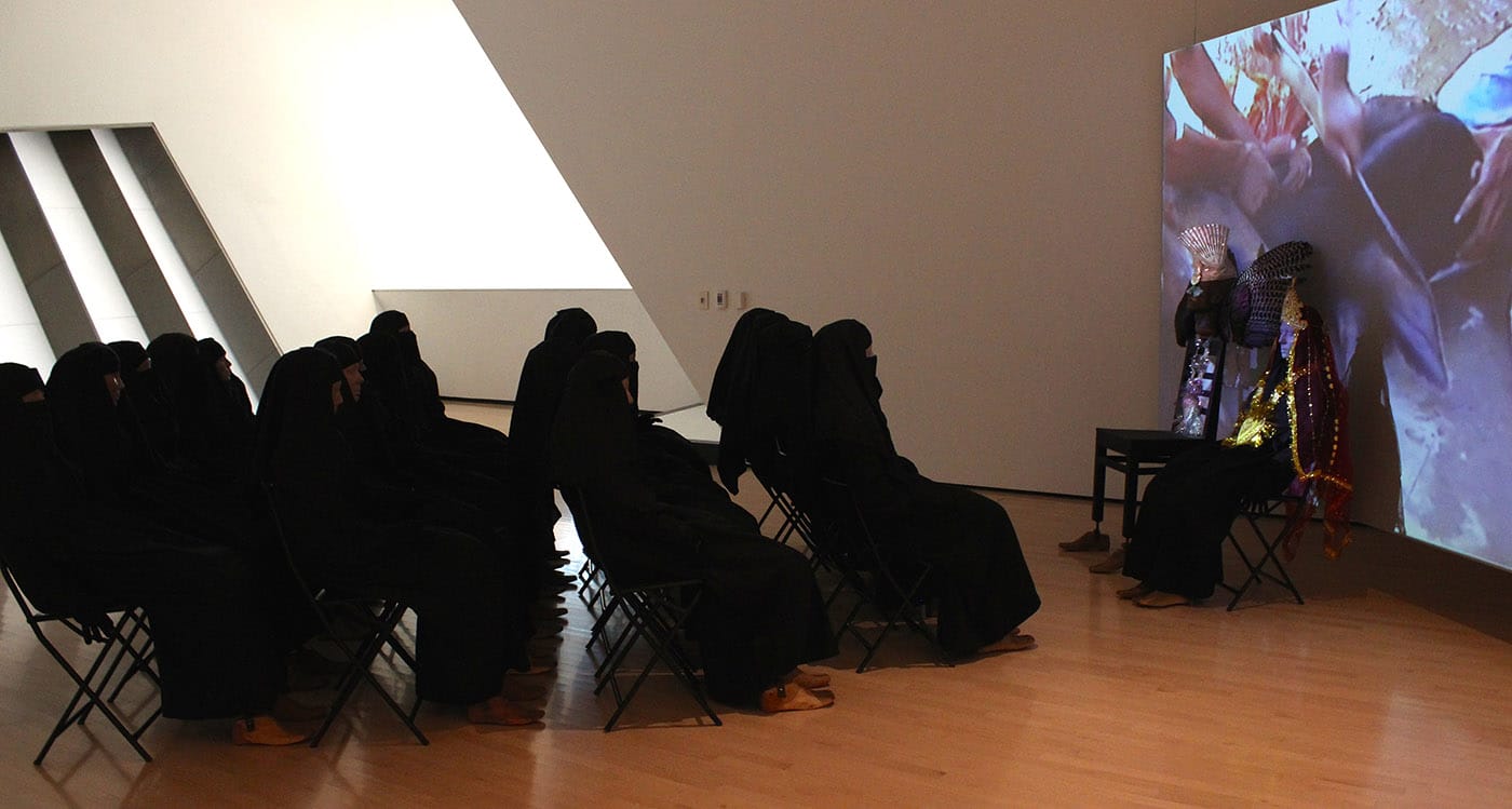 Mahbubur Rahman and Tayeba Begum Lipi, "Toys Are Watching Toys" (2002), installation with video projection (color, sound), mannequins, chairs, fiberglass with paint, fabric, and wings (click to enlarge)