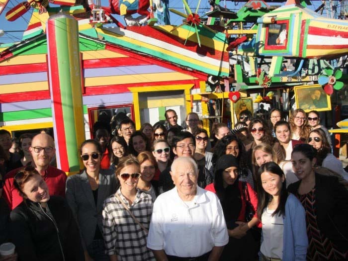 Dymtro Szylak (center) with a group of visitors to Hamtramck Disneyland. Photo courtesy of Hatch Art.