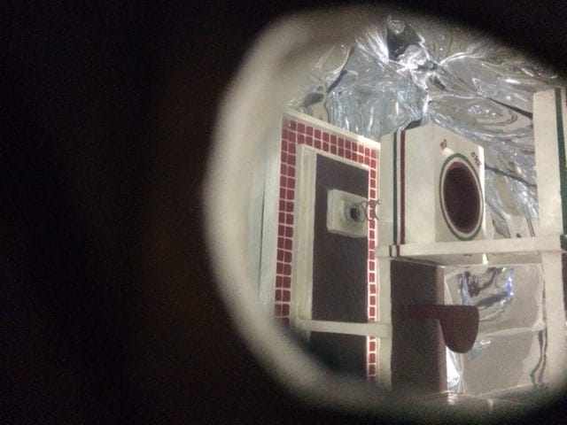 Peering inside the reflective room of the miniature Broad