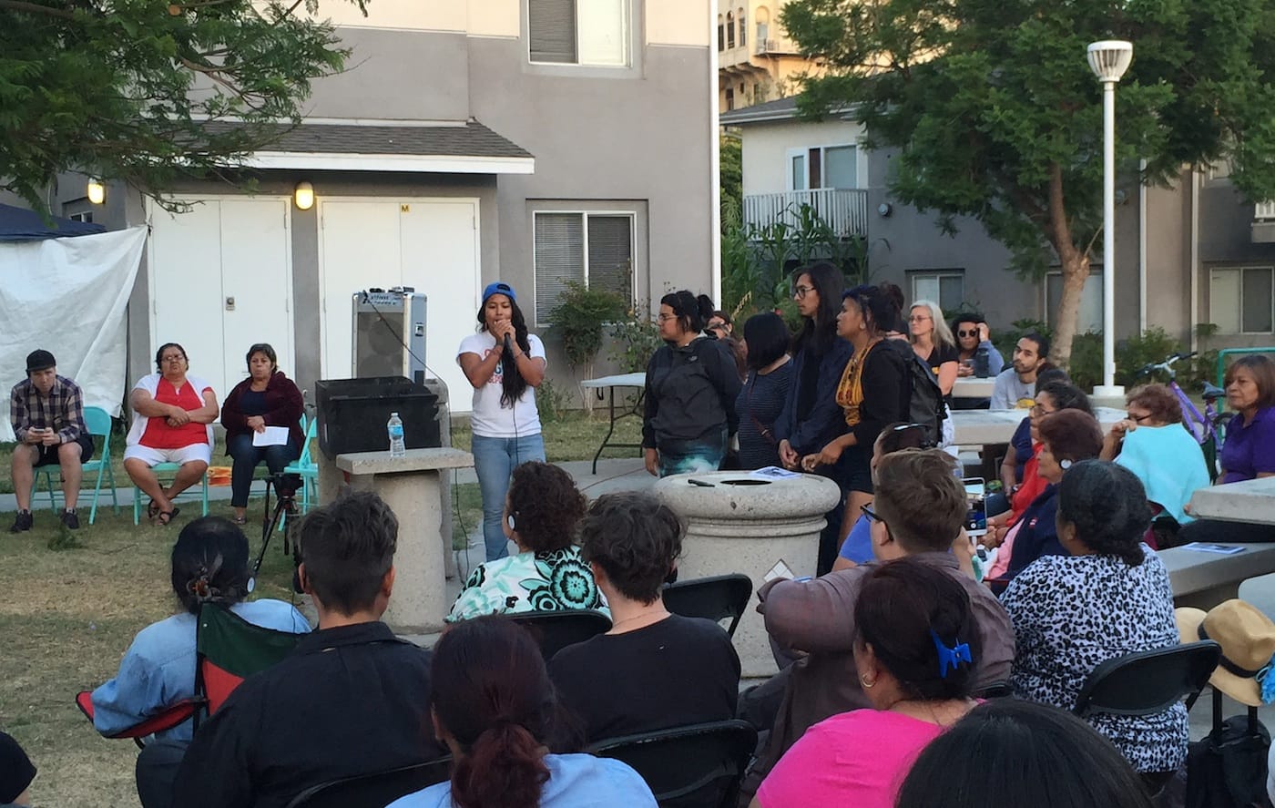Members of Defend Boyle Heights address the crowd at Pico Gardens