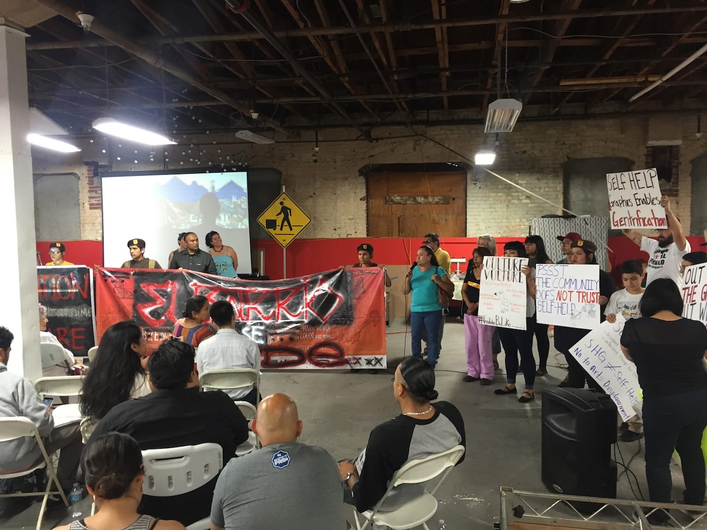 Defend Boyle Heights disrupts a meeting at Self-Help Graphics on July 2
