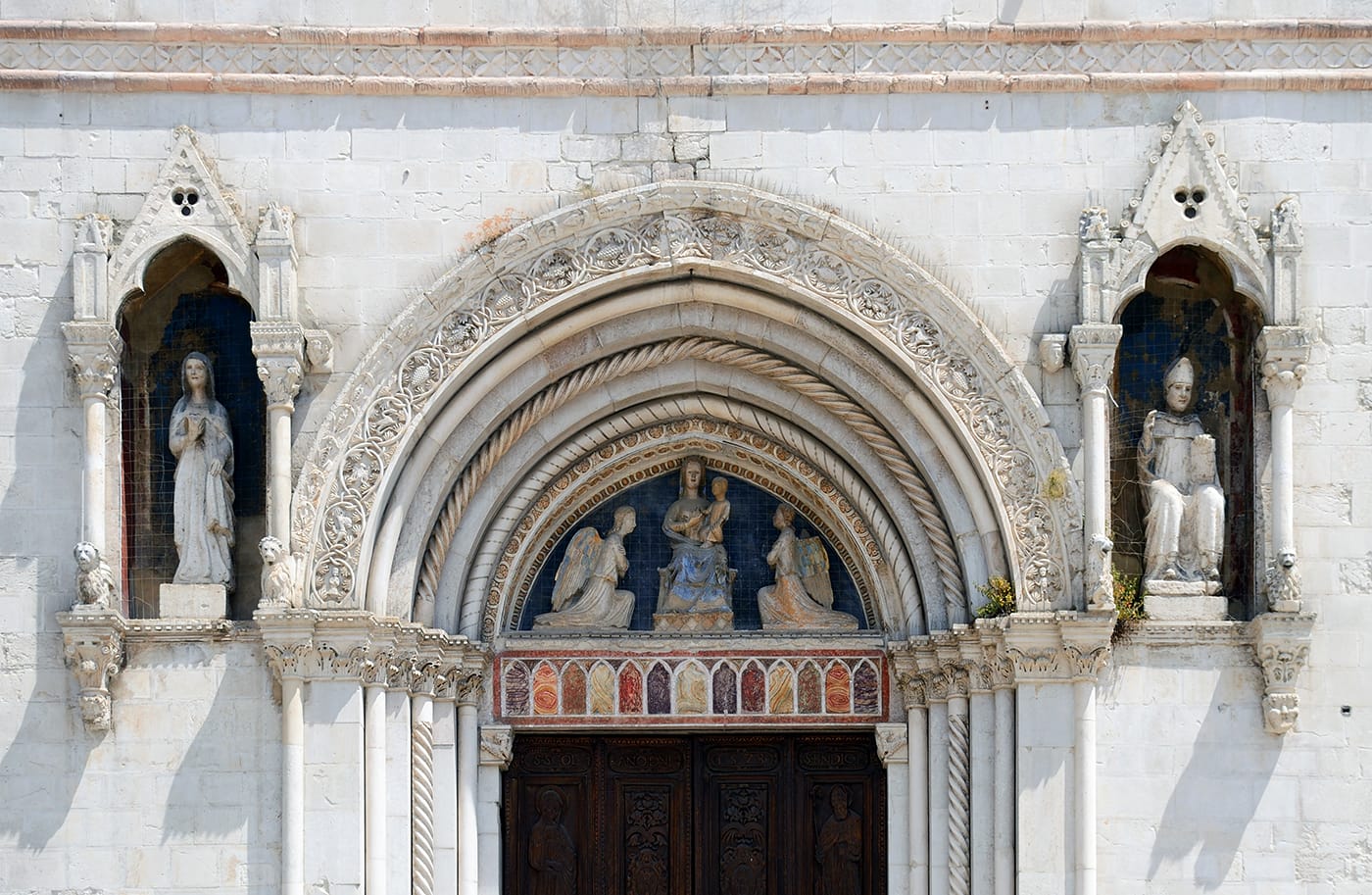 Decoration on the Basilica of St. Benedict in Norcia (photo by Livioandronico2013/Wikimedia Commons) (click to enlarge)