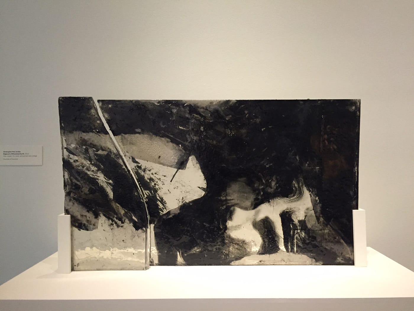 Christopher Paul Jordan, "Edges of a Silhouetted Earth" (2015), wax, copper, ink, mylar, and painted resin collage (photo by the author for Hyperallergic)