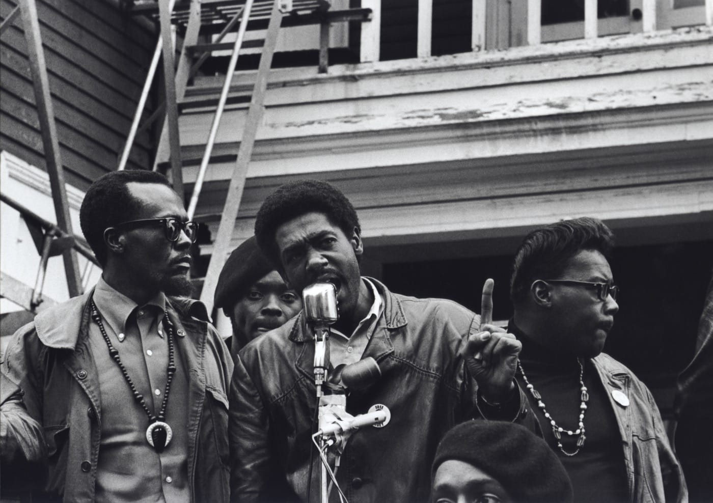 Stephen Shames Oakland, California, USA: Black Panther Chairman and co-founder Bobby Seale speaks at a Free Huey rally in Defermery Park (named by the Panthers Bobby Hutton Park) in West Oakland. Left of Seale is Bill Brent, who later went to Cuba. Right is Wilford Hol, July 28, 1968 Gelatin silver, printed 2006 16 x 20 in Signed and numbered by photographer verso; Edition of 8 + 2 Aps