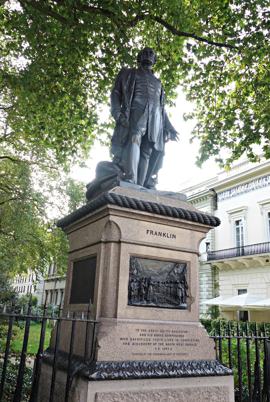 The Franklin Expedition Monument (1866) by Matthew Nobel in Waterloo Place, London (photo by the author for Hyperallergic)