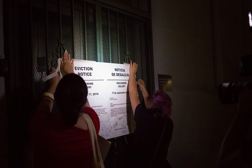 Protesters post eviction notices on the gates of Maccarone Gallery, September 16, 2016 (photo courtesy of Timo Saarelma)