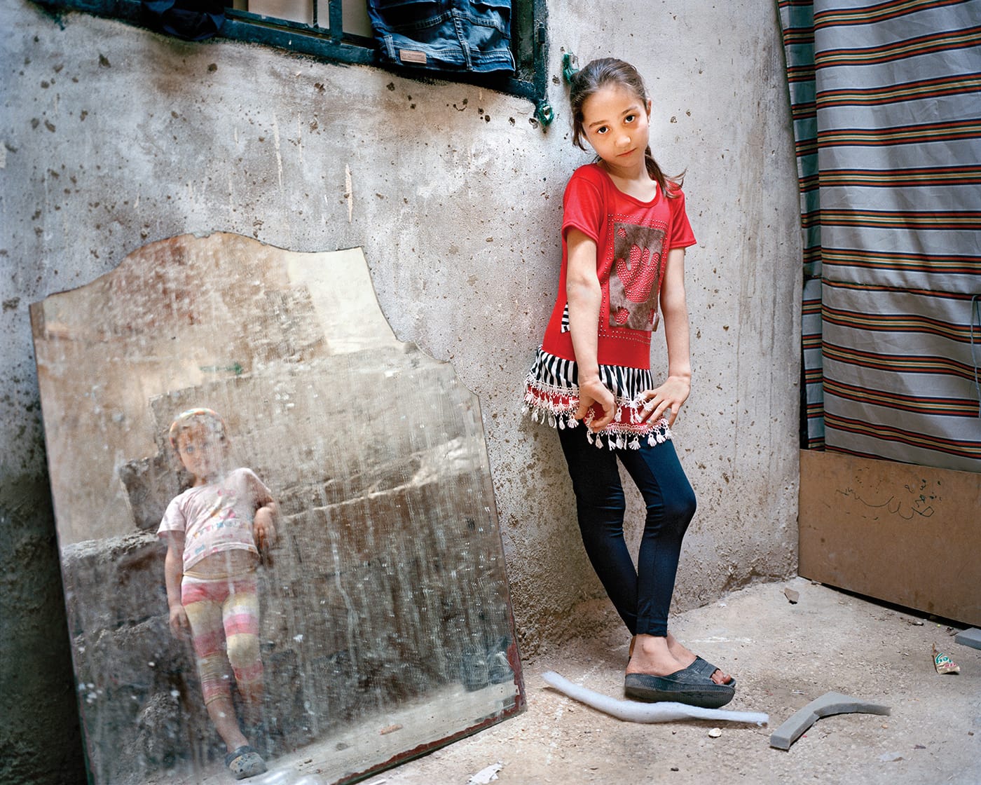 Rania Matar, "Amal 9, Zahra 5 (girl in the mirror), Beirut" (2014)