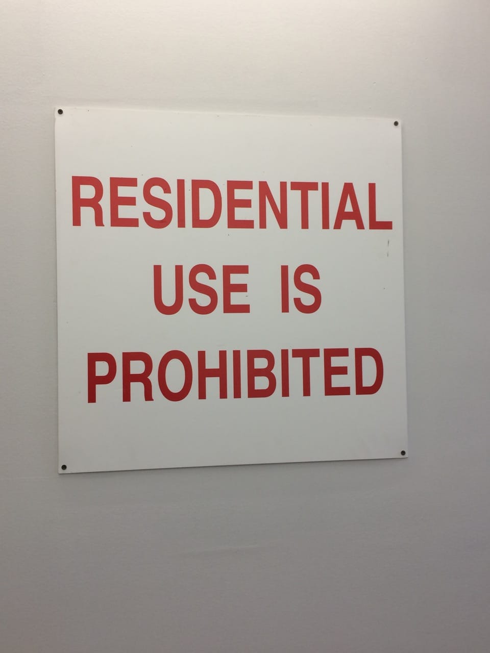 A sign inside 117 Grattan Street