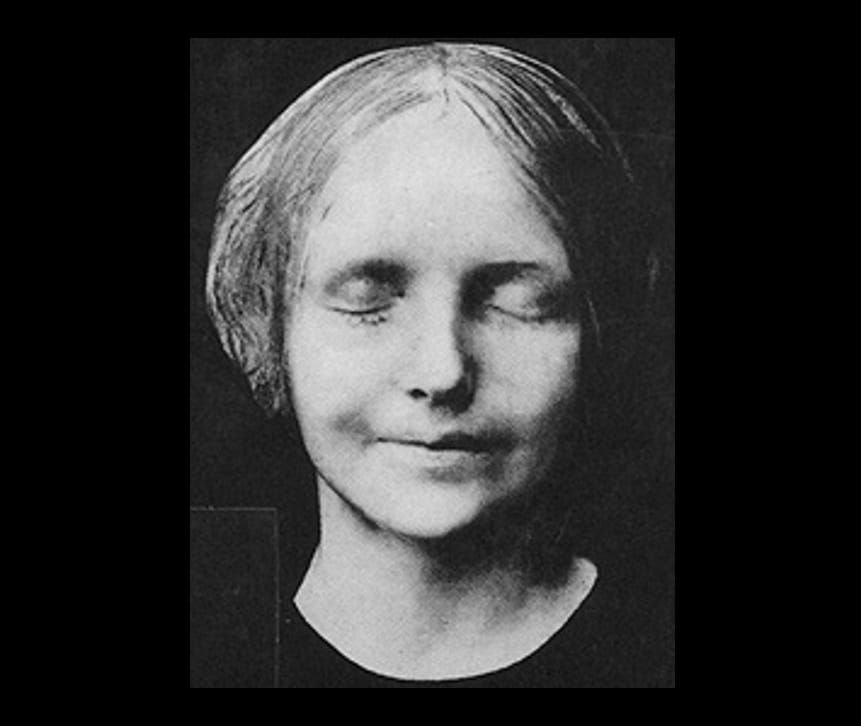 Death mask of L'inconnue de la Seine (1900 photograph) (via Wikimedia)