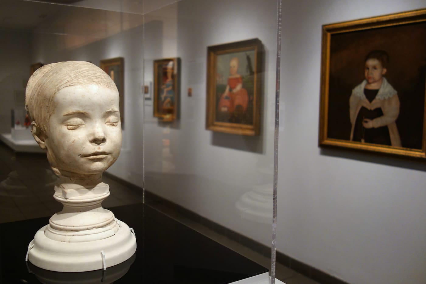 Installation view of 'Securing the Shadow: Posthumous Portraiture in America' at the American Folk Art Museum (photo by the author for Hyperallergic)