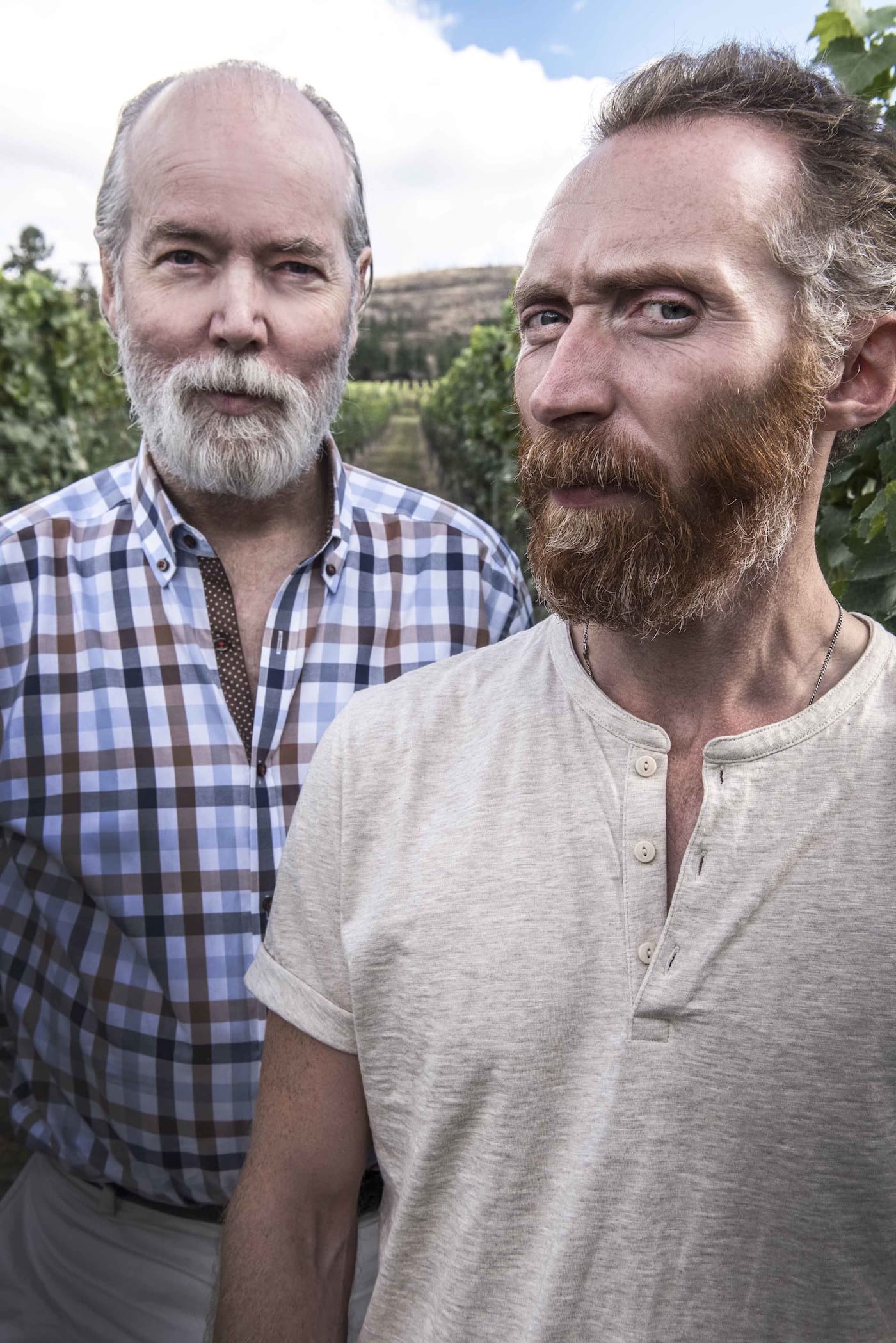 Artist Douglas Coupland and Van Gogh lookalike Daniel Baker together in the Pinot Noir vineyard at Martin’s Lane Winery in the Okanagan Valley, British Columbia. (CNW Group/VMF Estates)