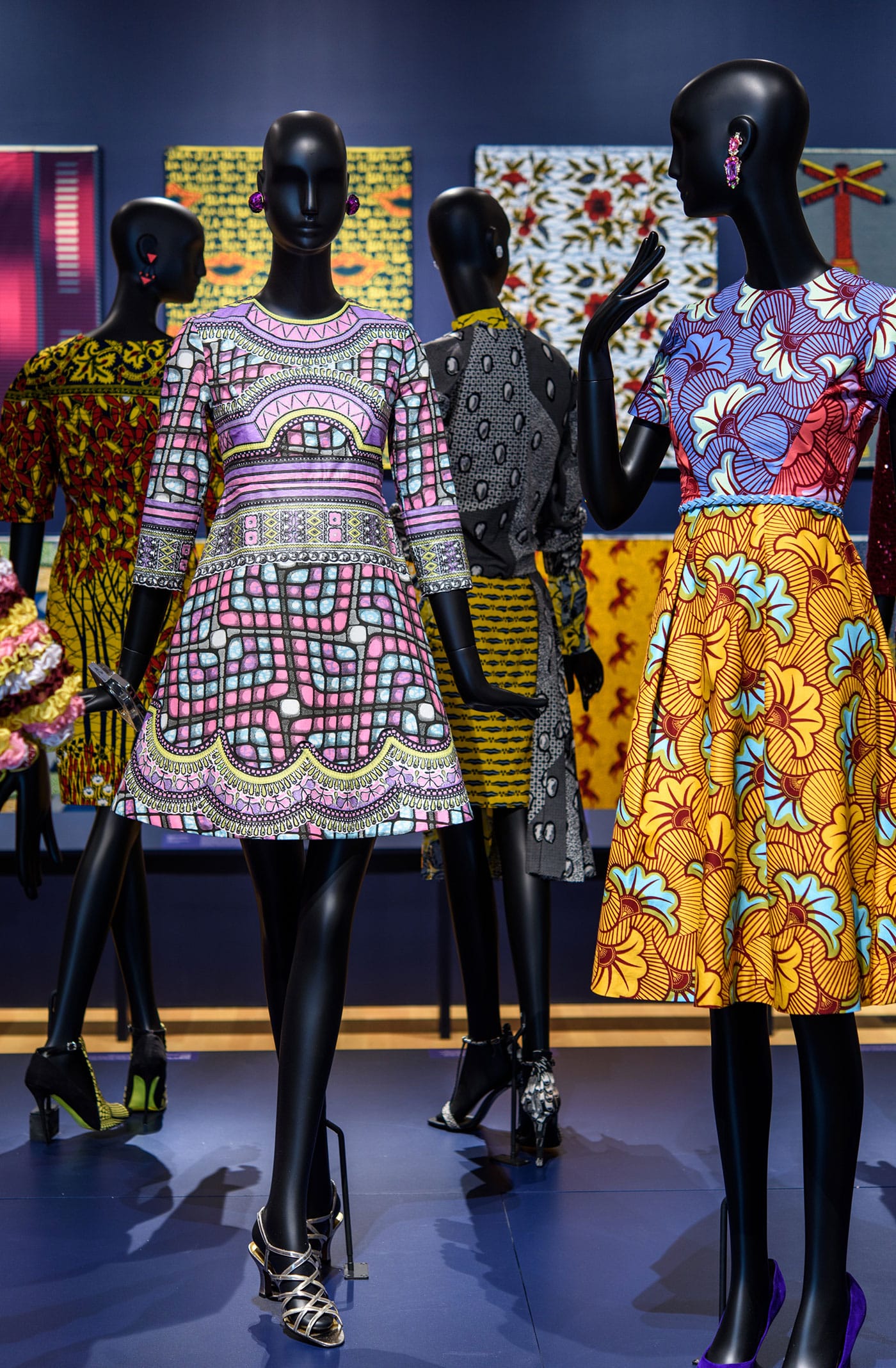 Patterns designed by Inge van Lierop for Vlisco. From left to right: dress, Bloom collection, season 2 (2014); dress, Bright and Beautiful collection, season 2 (2016); ensemble, Fantasia collection, season 3 (2014); dress, Bloom collection, season 2 (2014); all cotton and wax block prints