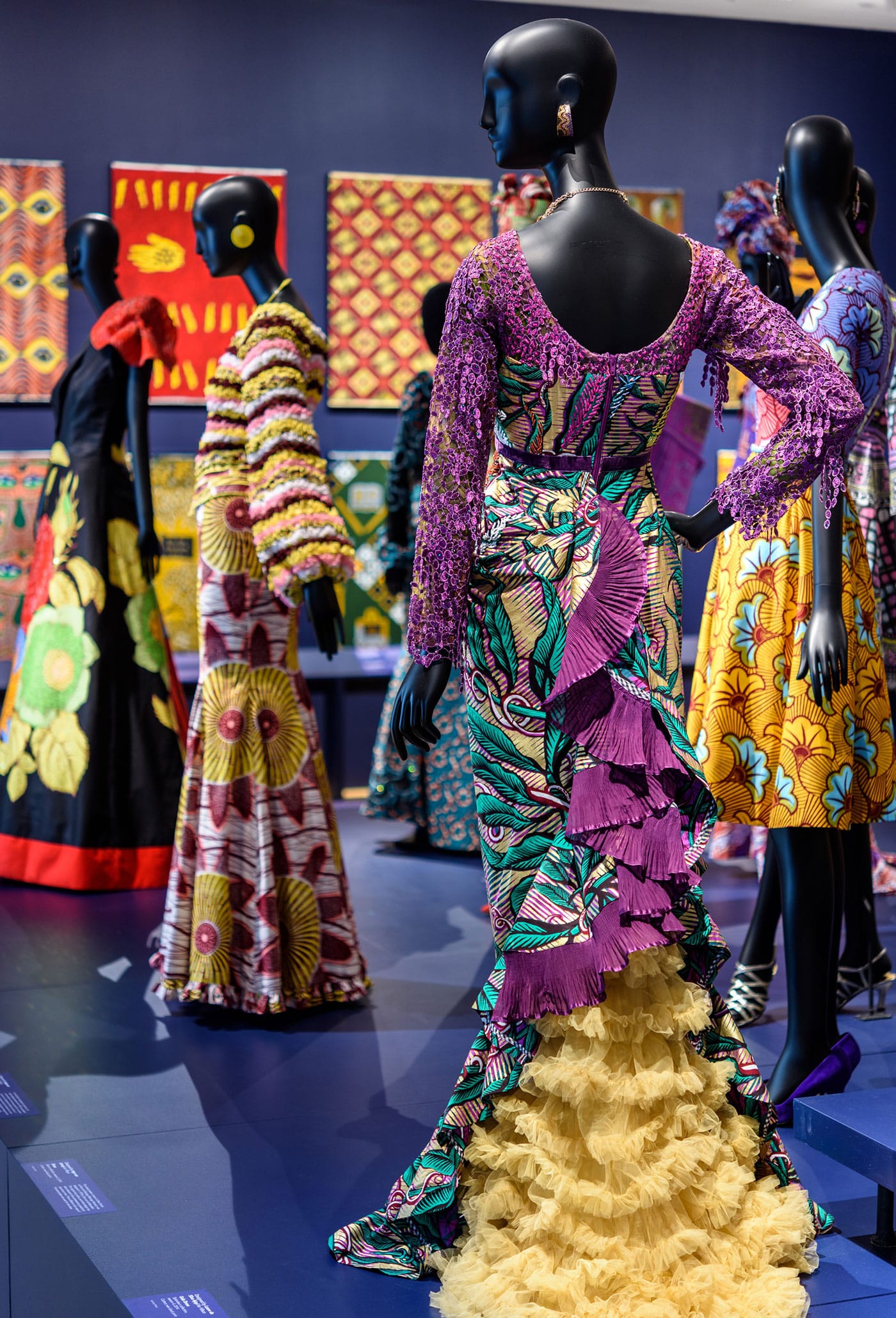 Garments made with Vlisco fabrics. From left to right: Pepita D, Gala Dress (2016), cotton, Java print, sequins; Josephine Memel, Gala Dress (2016), cotton; wax block print; Lanre da Silva Ajayi for Vlisco, Gala Dress, Splendeur collection, season 4 (2014), cotton, wax block print (photo by Tim Tiebout, courtesy the Philadelphia Museum of Art)