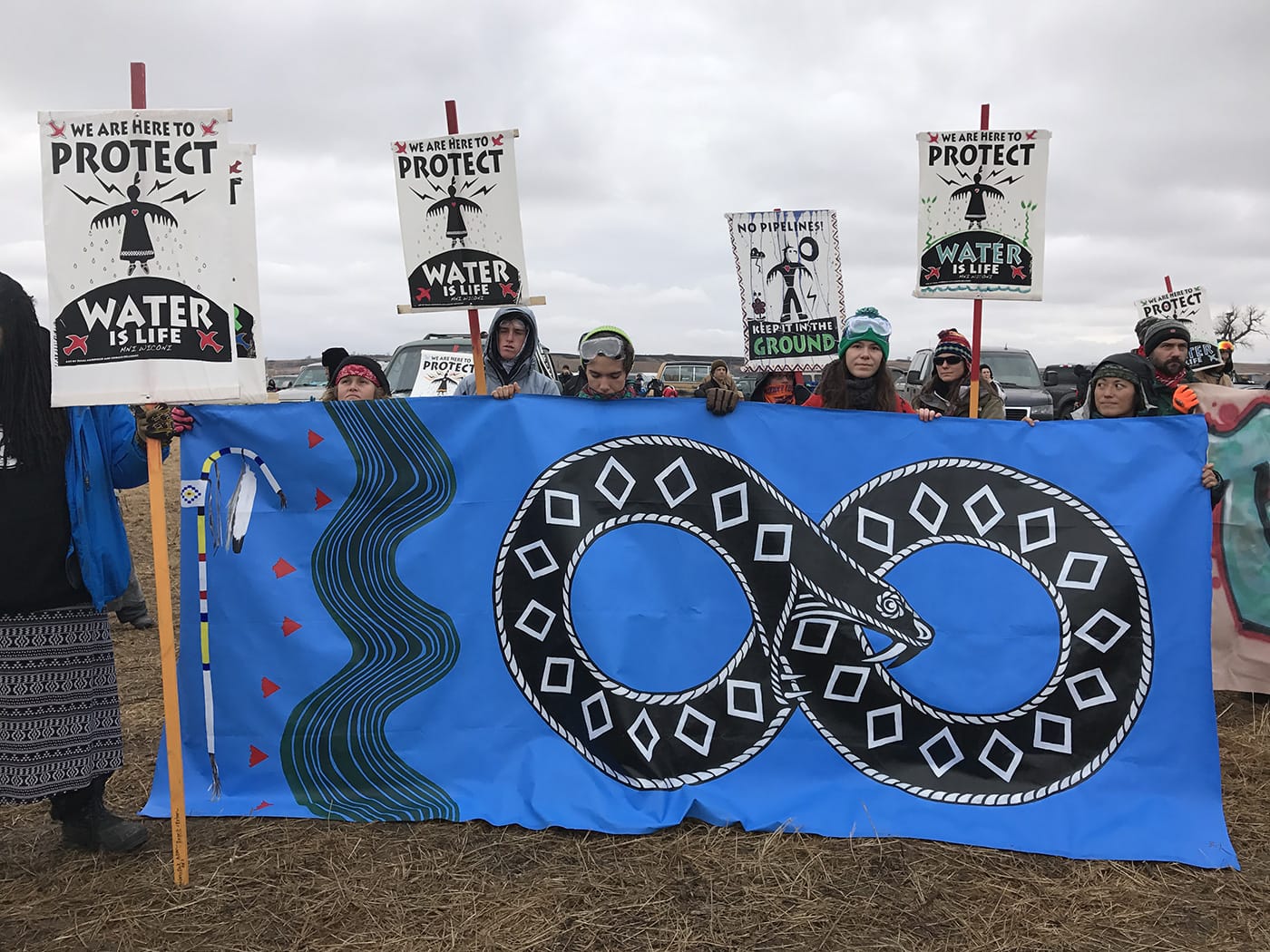 A banner by artist Jesse Hazelip at the frontlines near Oceti Sekawan Camp at Standing Rock (photos by the author for Hyperallergic)