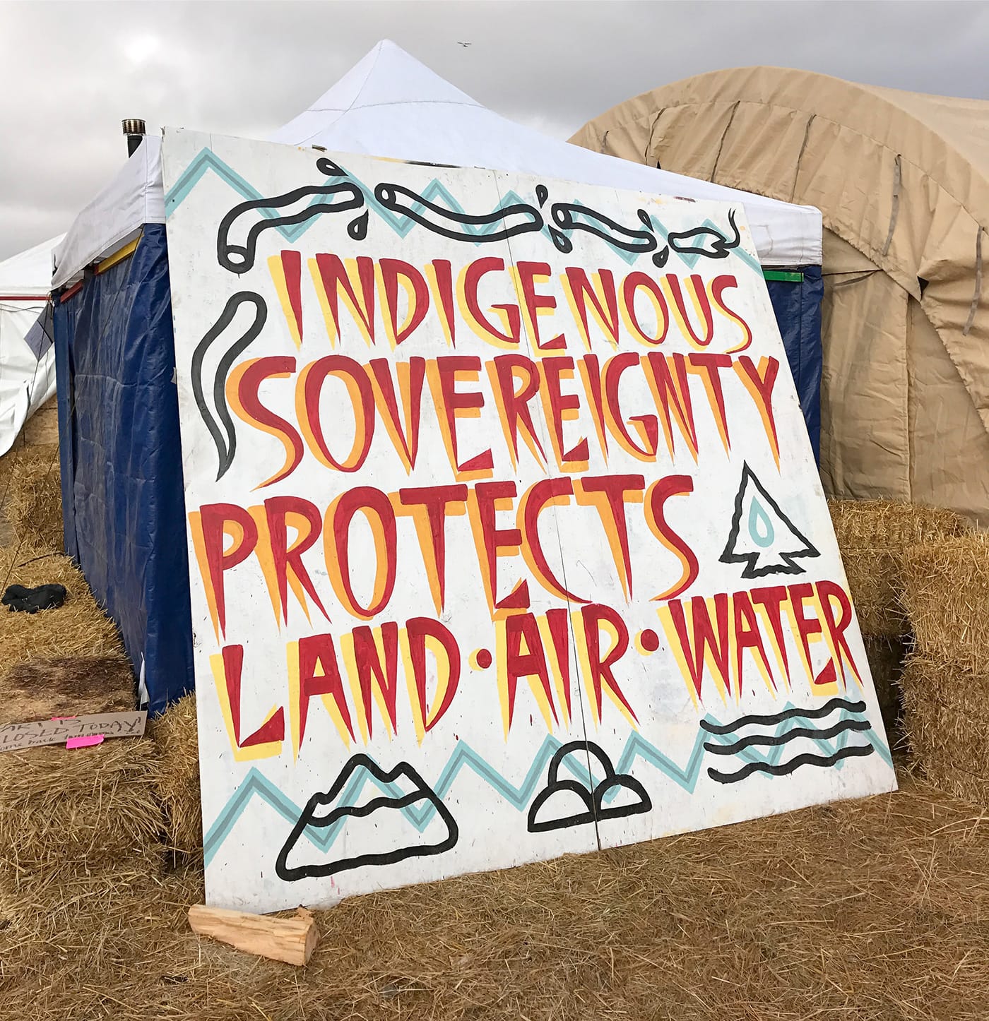 A sign by the art tents at Oceti Sakowin Camp