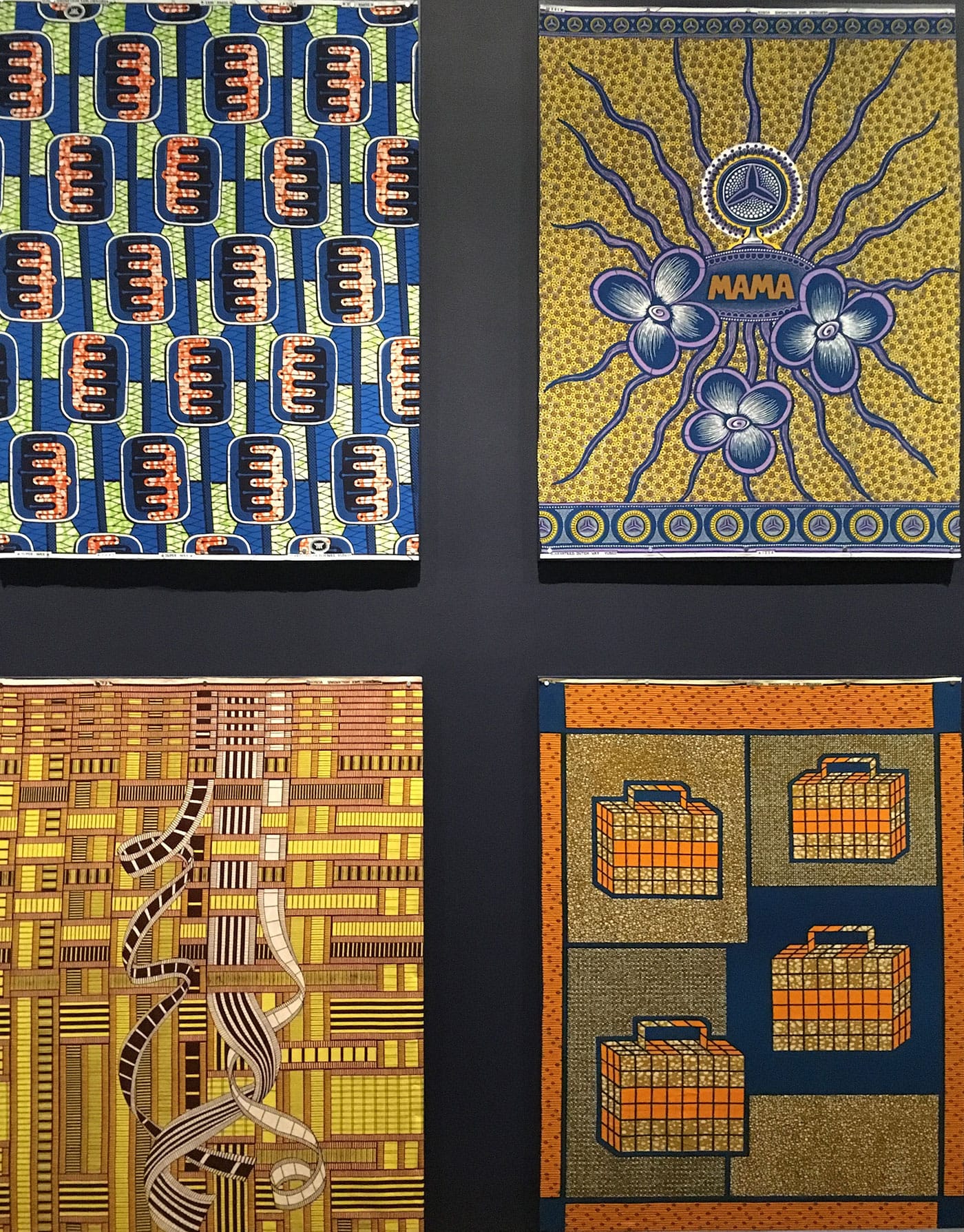 Textile patterns in Vlisco: African Fashion on a Global Stage, with the Mama Benz pattern by Christof Zürn for Vlisco in upper right (photo by the author for Hyperallergic)