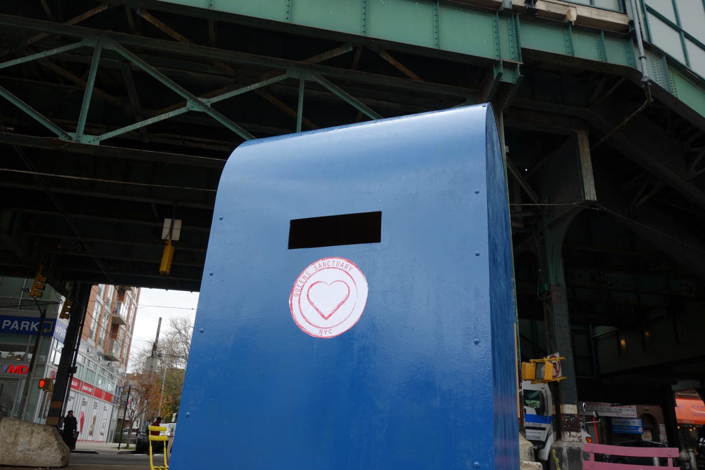 The giant mailbox at Diversity Plaza for the "Letters from Home" postcards (photo by the author for Hyperallergic)