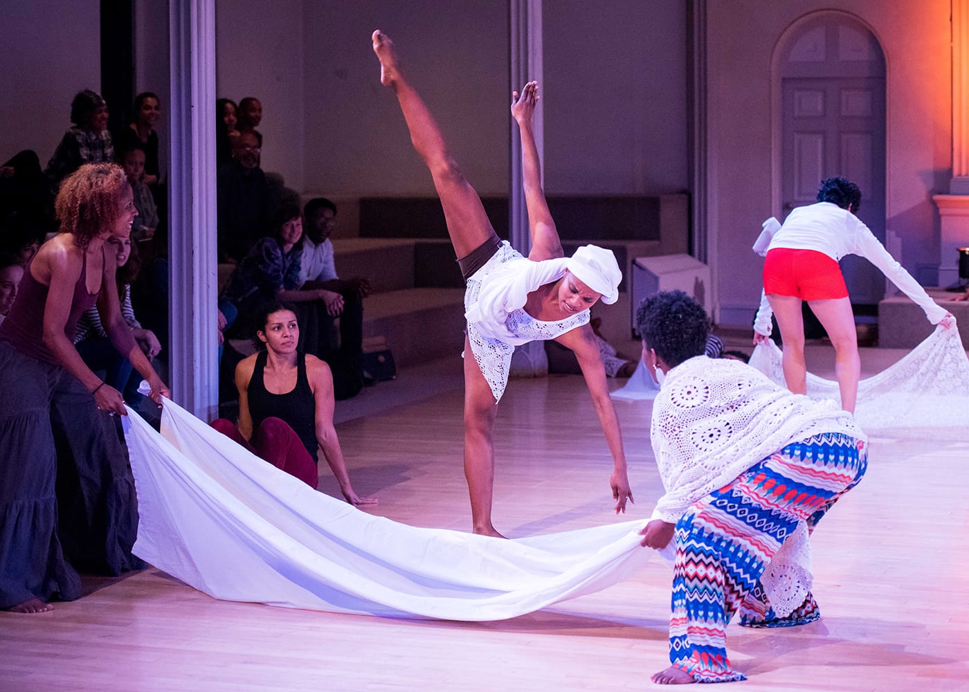From left to right in the foreground: Rakiya Orange, Maria Bauman, Charmaine Warren, Davalois Fearon, and Edisa Weeks. Performing in the skeleton architecture, or the future of our worlds, Danspace Project. Photo: Ian Douglas/courtesy Danspace Project.