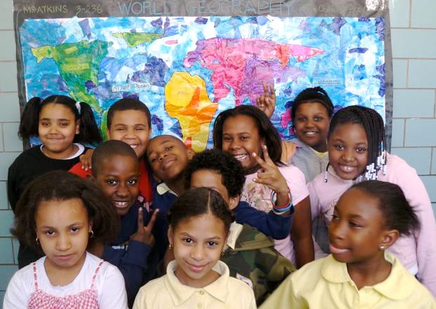 Youth at The Children's Art Carnival in front of a mural they created. Courtesy of Marline A. Martin.