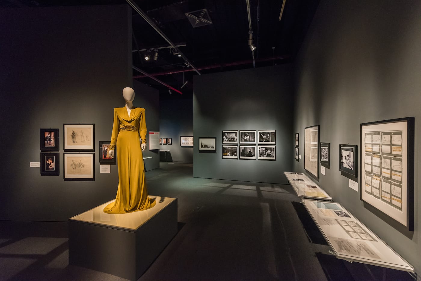 In the foreground, a costume designed by Sandy Powell and worn by Cate Blanchett as Kathryn Hepburn in <em/>The Aviator (2004) in <em>Martin Scorsese</em> at the Museum of the Moving Image (photo by Thanassi Karageorgiou, courtesy the Museum of the Moving Image)