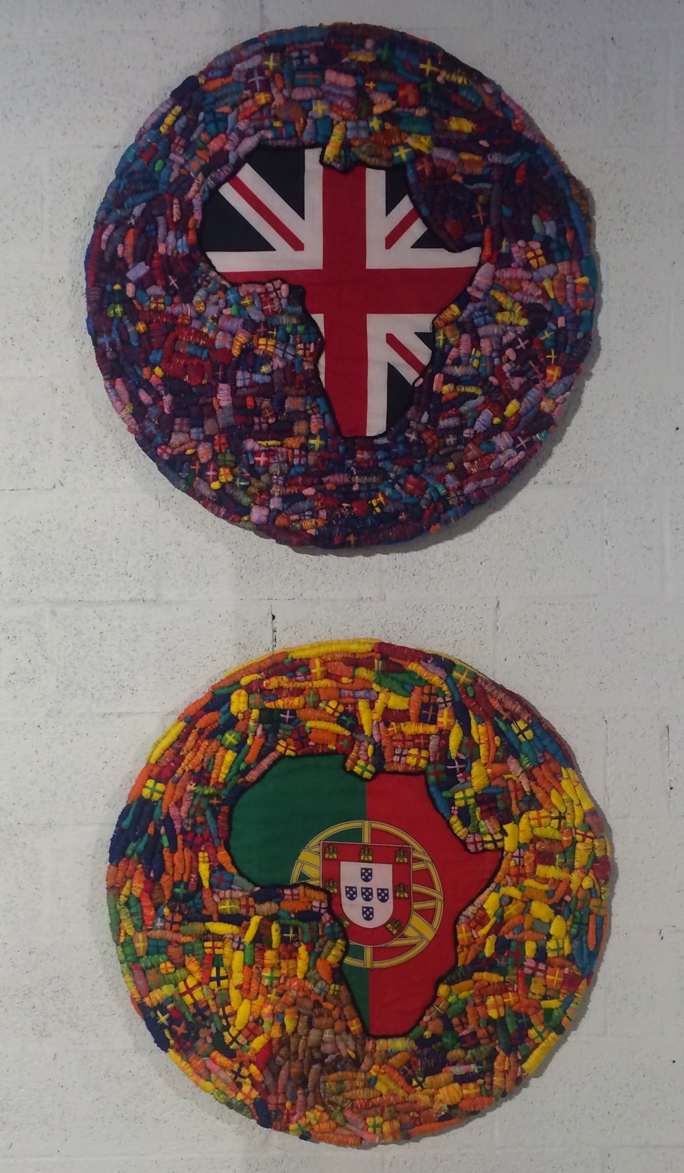 Wole Lagunju, “Perspectives on Colonialism V” (2016, top), recycled clothing with acrylic, cotton and synthetic threads on paperboard, 36 in; “Perspectives on Colonialism VI” (bottom), recycled clothing with acrylic, cotton and synthetic threads on paperboard, 36 in