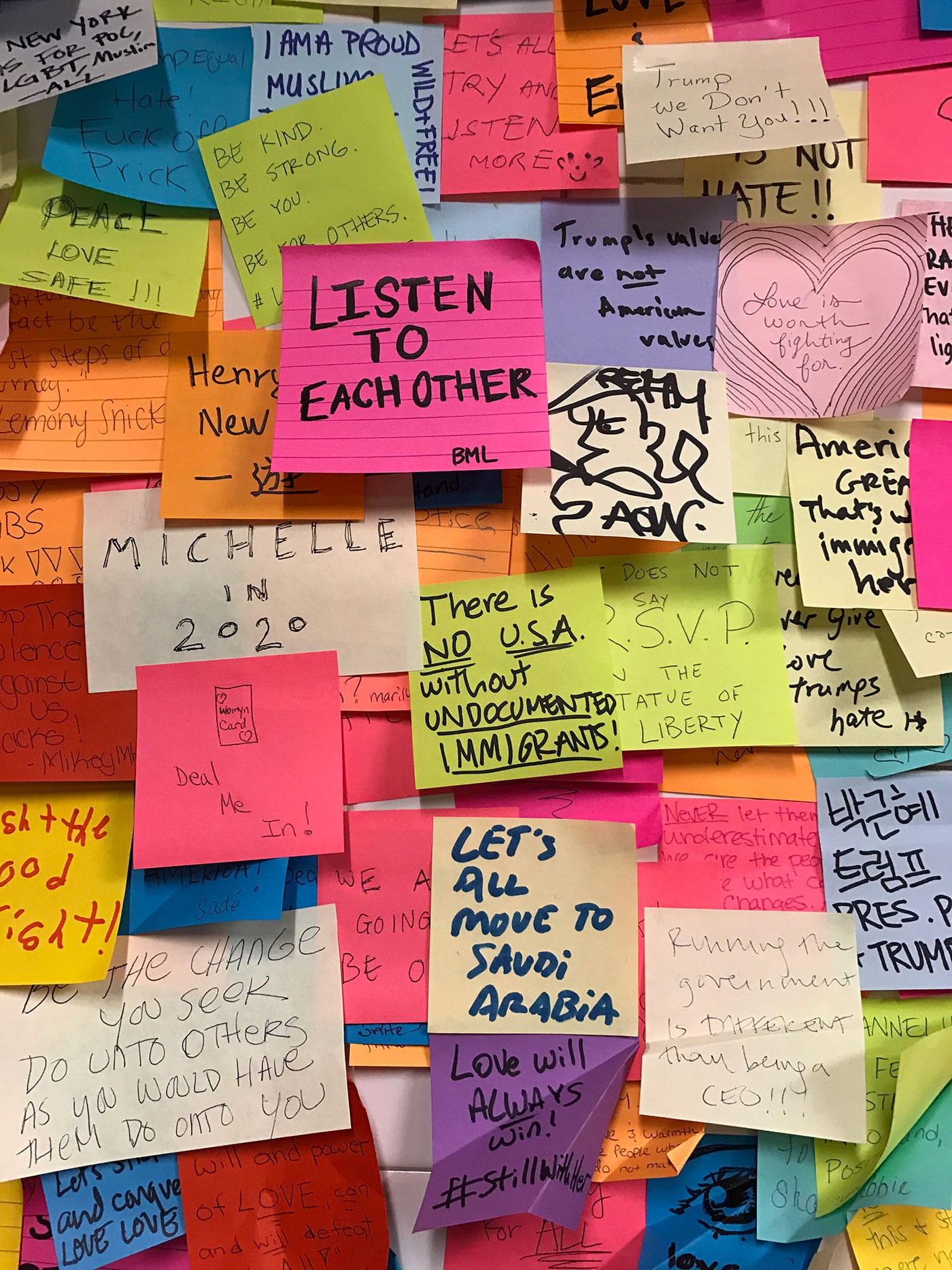 Sticky notes of solidarity cover multiple walls in NYC's Union Square subway station after the 2016 presidential election. (photo by Jillian Steinhauer/Hyperallergic)