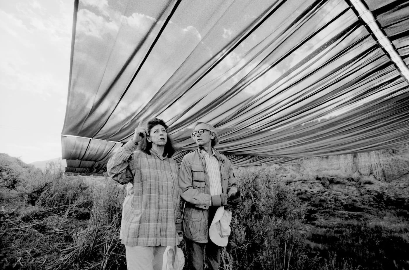 Christo and Jeanne-Claude during the life-size test for "Over The River," summer 1999 (photo by Wolfgang Volz, © 1999 Christo)