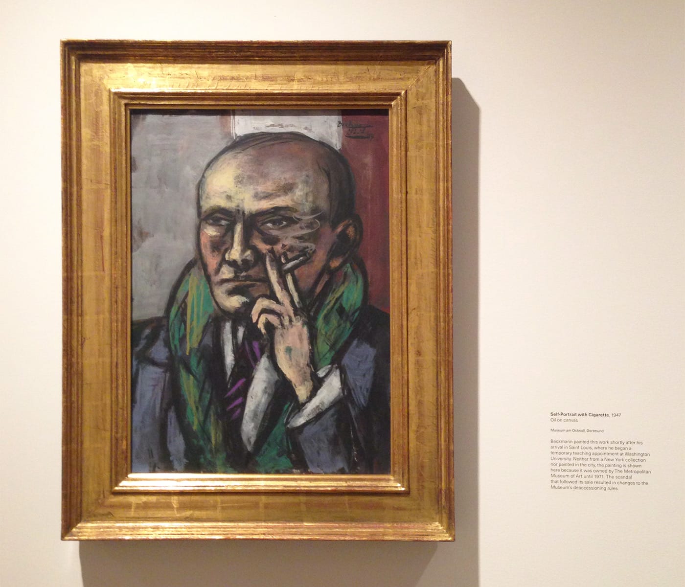 Installation view of <em>Max Beckmann in New York</em> at the Metropolitan Museum of Art with Max Beckmann, "Self-Portrait with Cigarette" (1947), oil on canvas, 25 x 17 15/16 in, Museum Ostwall, Dortmund (photo by Hyperallergic)