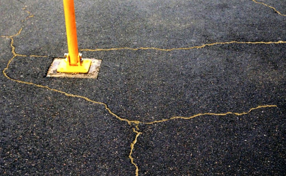 An Artist Mends Cracks in the Sidewalk with Gold