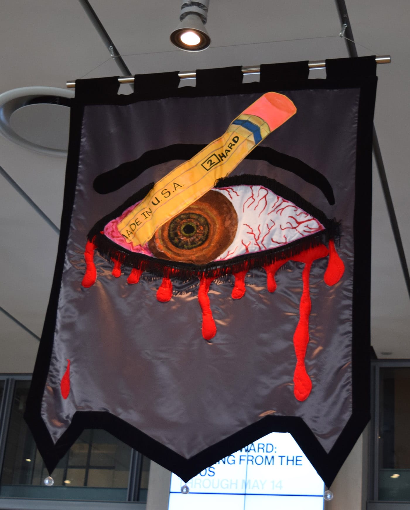 Cauleen Smith, "In the Wake" (2017), satin, poly-satin, quilted pleather, upholstery, wool felt, wool velvet, indigo-dyed silk-rayon velvet, indigo-dyed silk satin, embroidery floss, metallic thread, acrylic fabric paint, acrylic hair beads, acrylic barrettes, satin cord, polyester fringe, poly-silk tassels, plastic-coated paper, and sequins (photo by Benjamin Sutton for Hyperallergic)