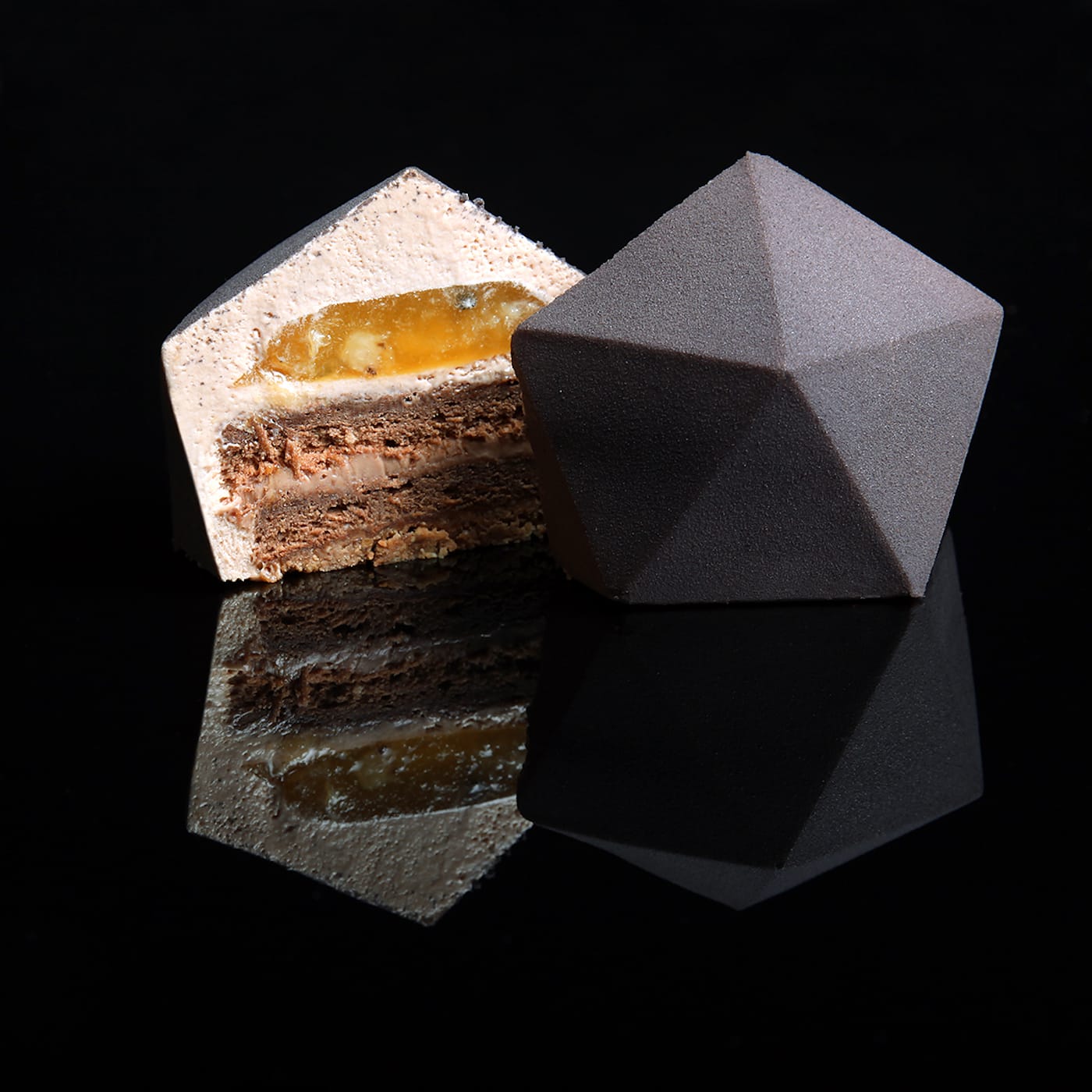 Chocolate sponge cake, streusel with nuts, mousse with chocolate Valrhona Caramelia, ganache with Caramelia and yuzu, jelly with yuzu and passion fruit, by Dinara Kasko
