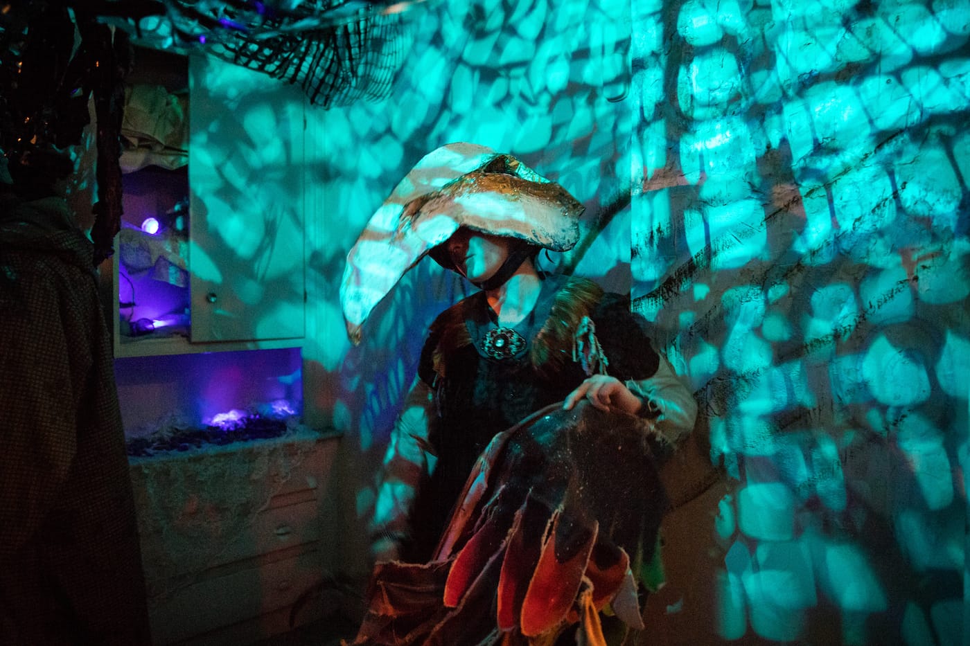 A bird performer in Jaclyn Atkinson’s “Bowerbird Nest”