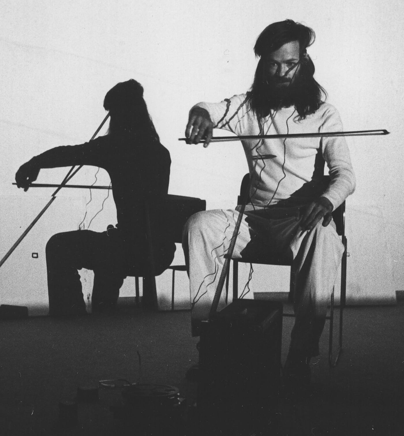 Tony Conrad performance of “Bowed Film” (1976) (photo by Linda Edelstein)