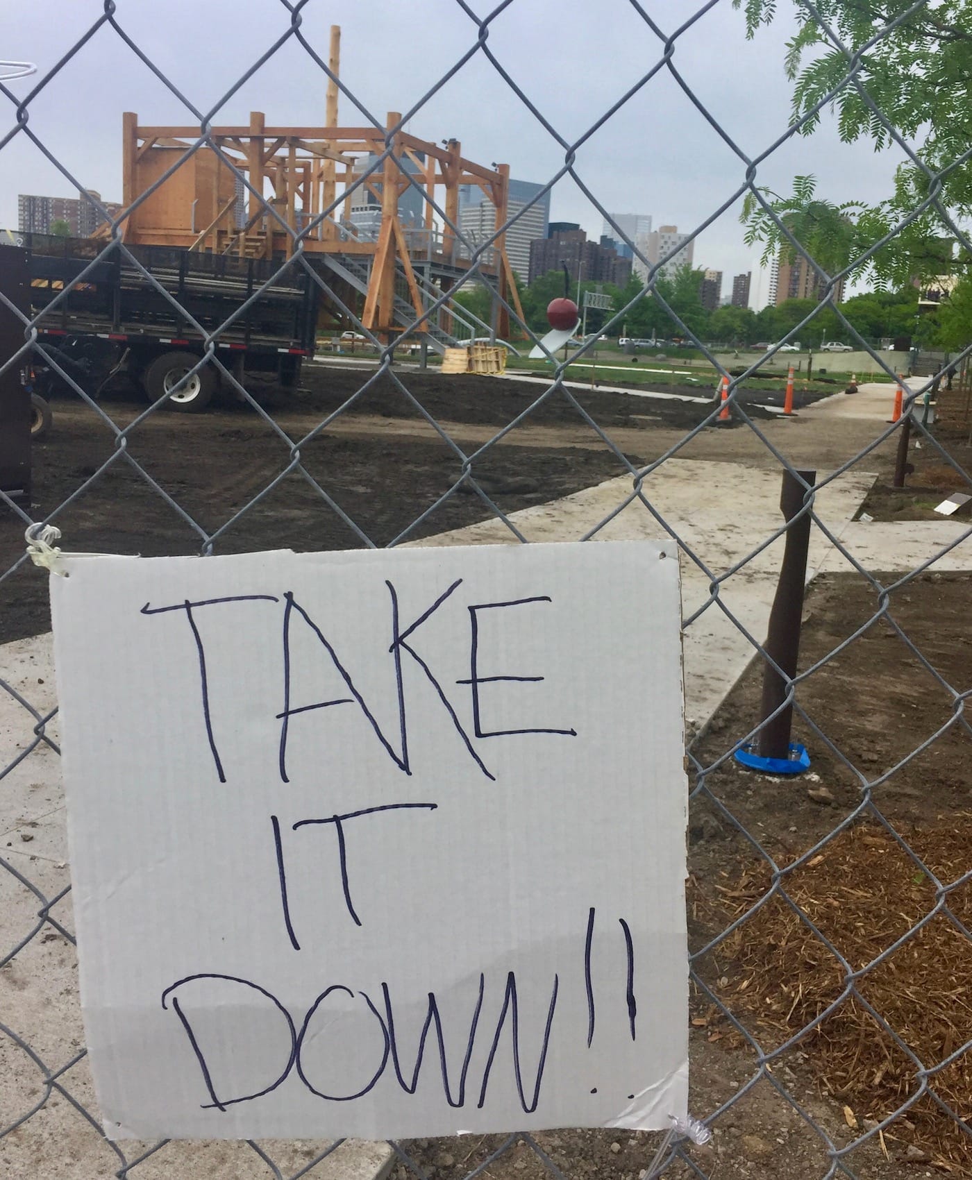 Protest signs on the fence near Sam Durant's "Scaffold" (2012) in the Minneapolis Sculpture Garden