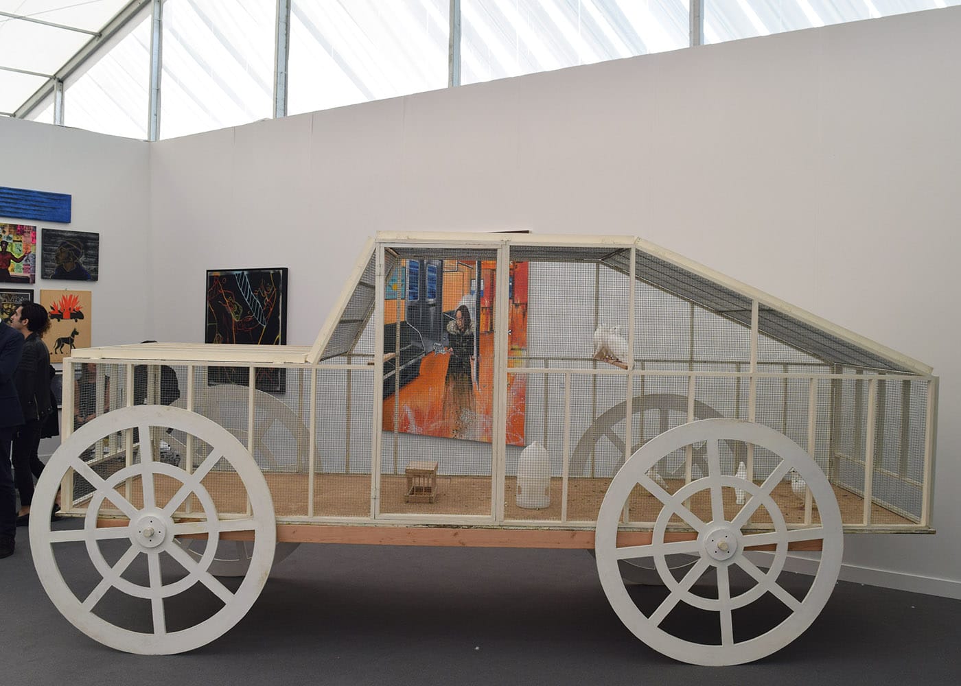 Anton van Dalen, "The Pigeon Car" (1987, wood, wire, live pigeons) in the PPOW booth