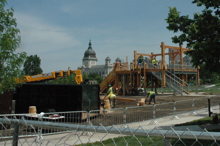Sam Durant's "Scaffold" early on Friday as workers began dismantling it and at sunset, with only its metal framework remaining.