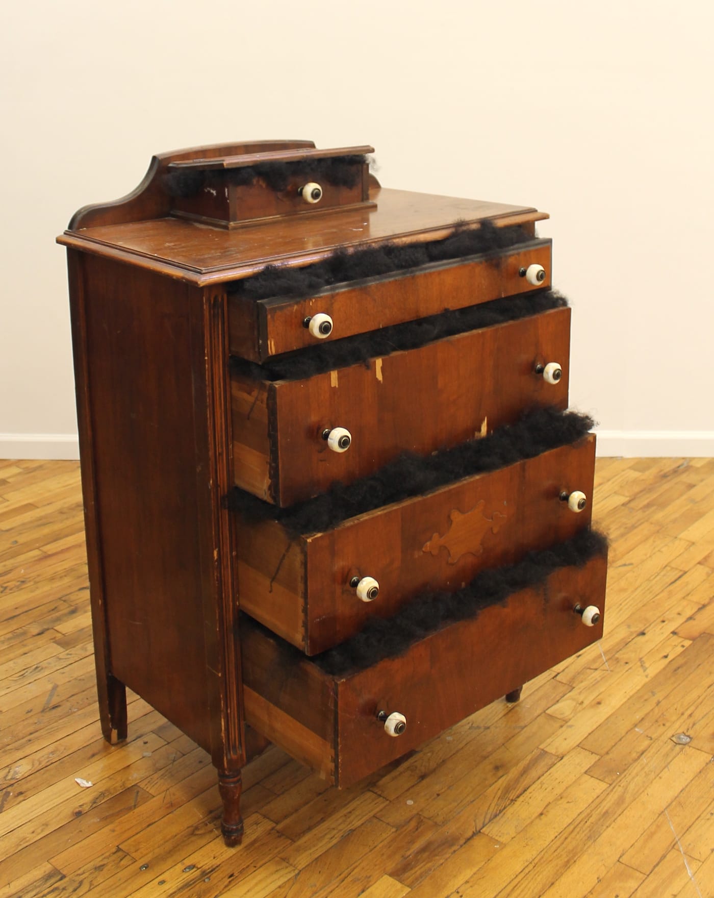 Doreen Garner, "Untitled: Bureau" (2017), hair weave, bureau