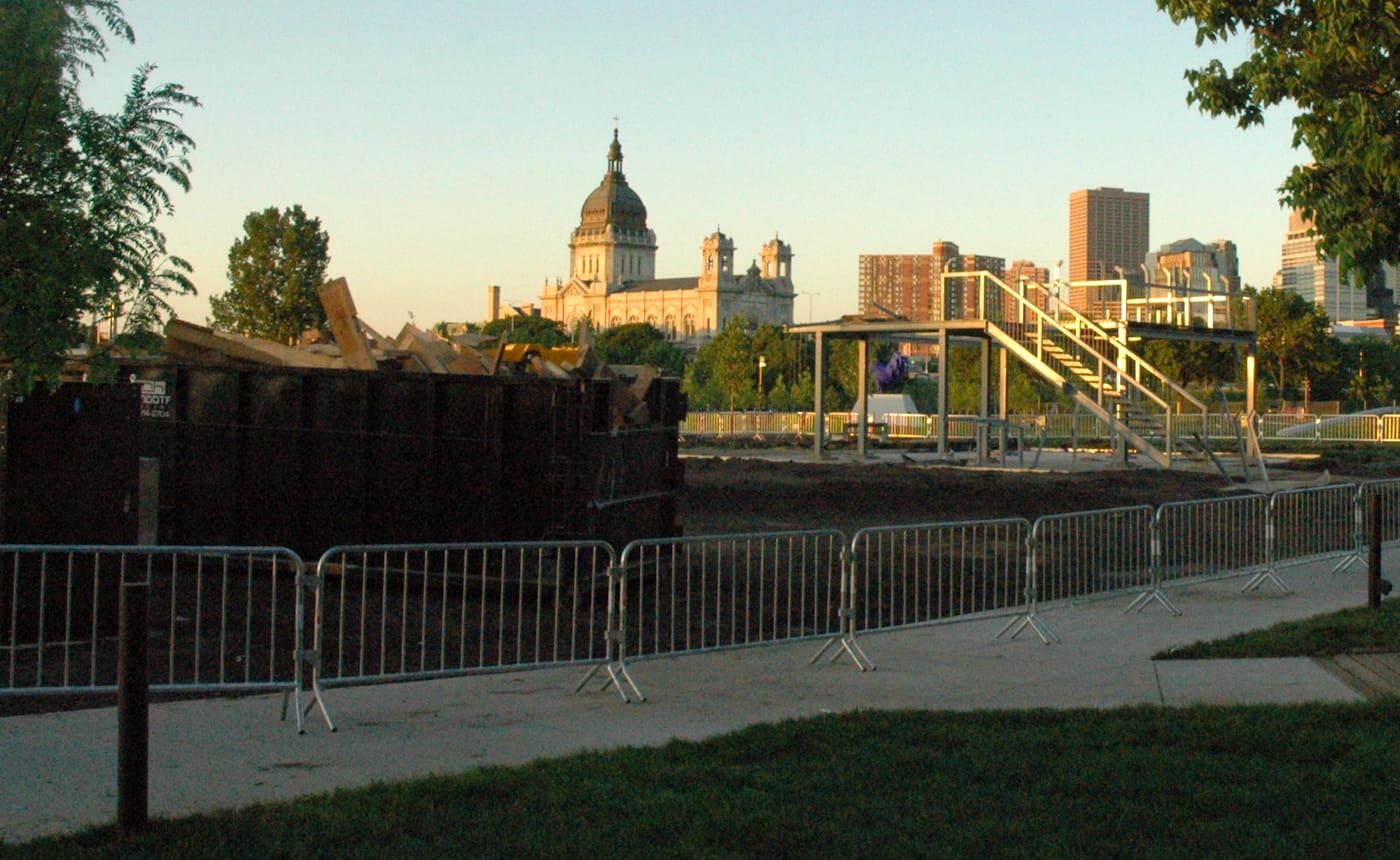 Sam Durant's "Scaffold" (2012) mostly dismantled at the end of the day on Friday, with its wooden parts in a bin at left (photo by Sheila Regan/Hyperallergic)