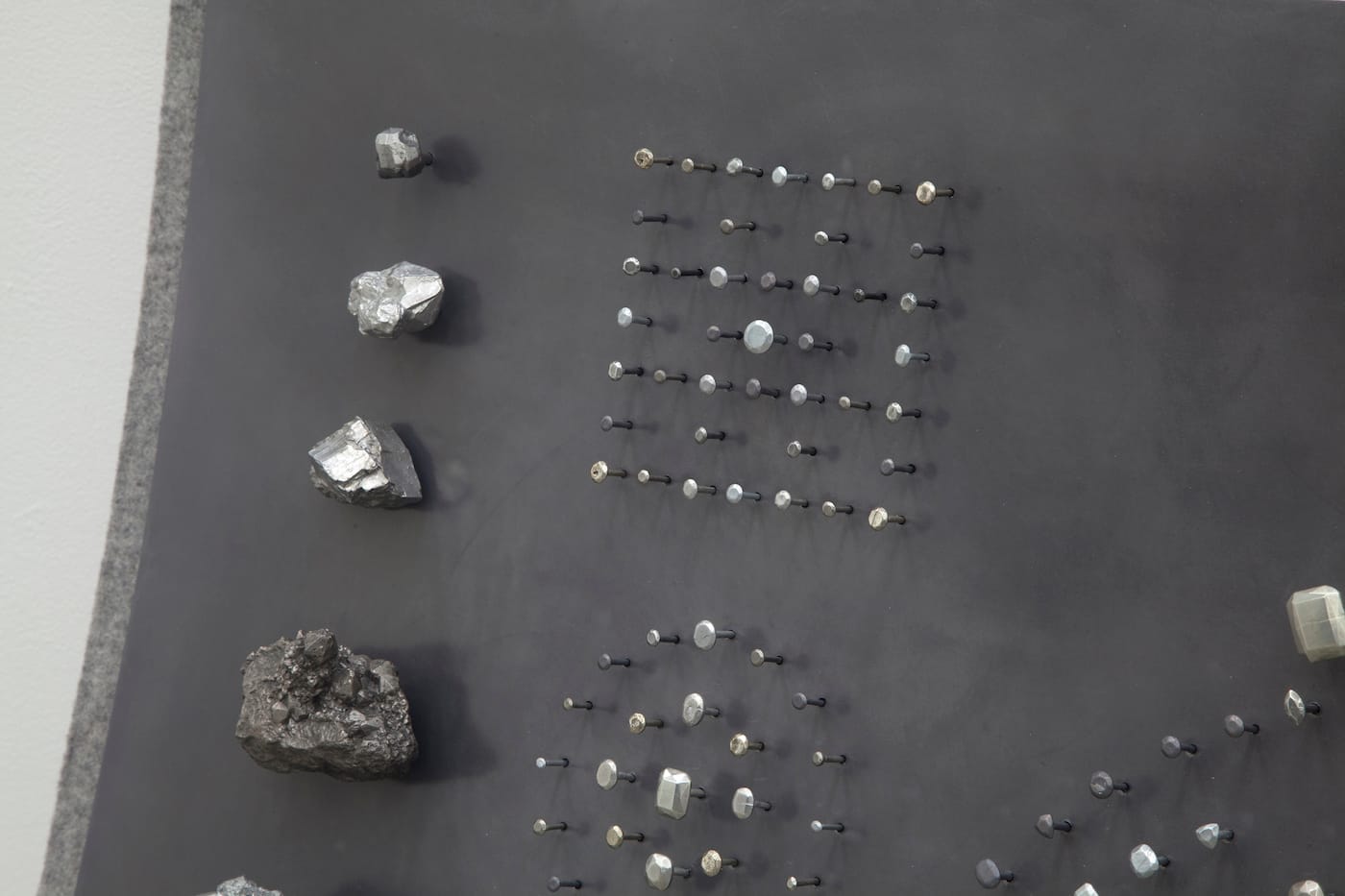 Detail of John Stoney, "Gems" (2017), elemental aluminum, antimony, bismuth, cadmium, indium, iron, lead, nickel, silver, tin, zinc, felt, 40 1/2 x 48 x 9 1/2 in