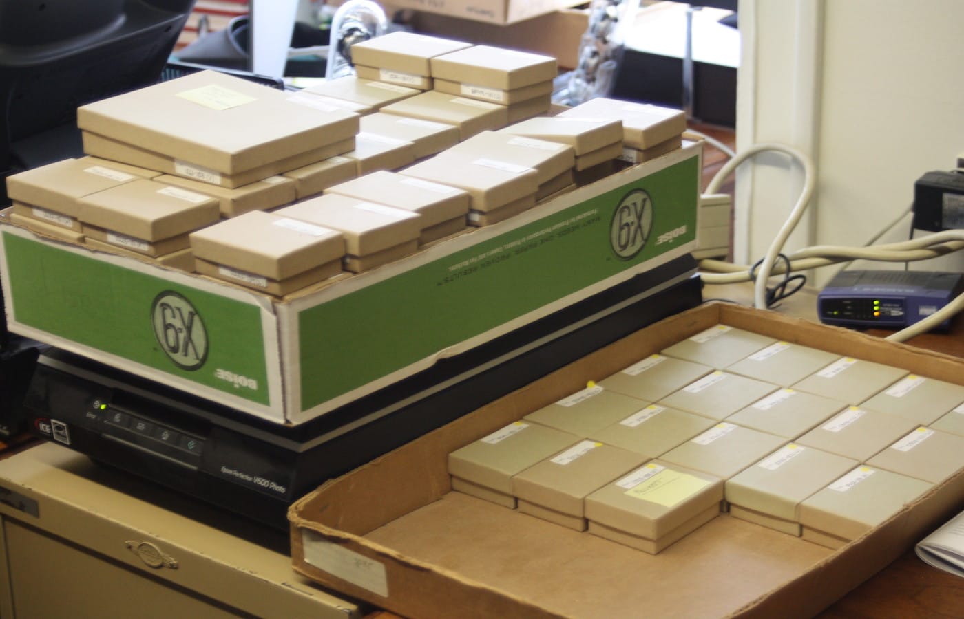 Boxes containing objects from the Persepolis Collection await analysis on Matthew Stopler's desk at the Oriental Institute at the University of Chicago.