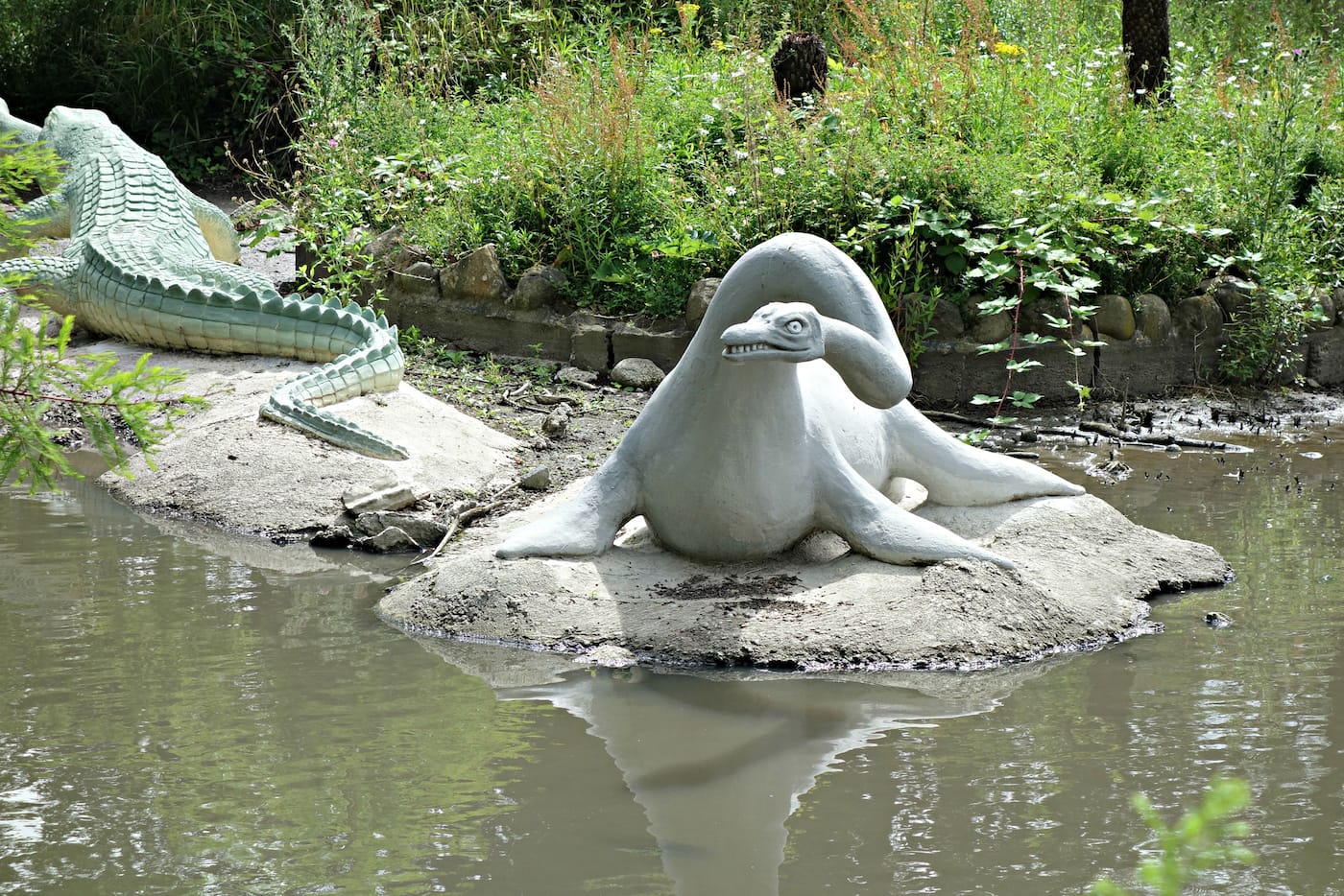 Dinosaur sculptures in Crystal Palace Park, London (photo by the author for Hyperallergic)