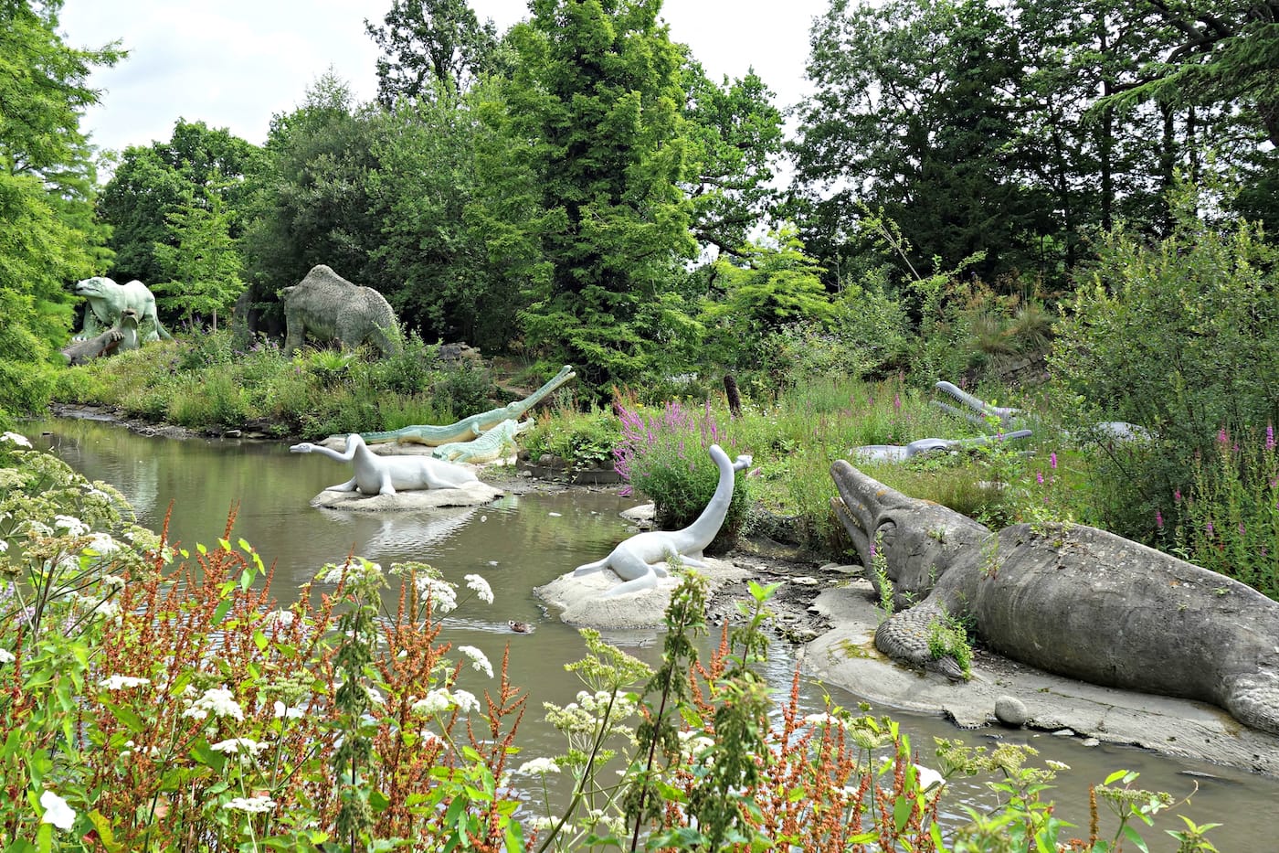 Dinosaur sculptures in Crystal Palace Park, London (photo by the author for Hyperallergic)