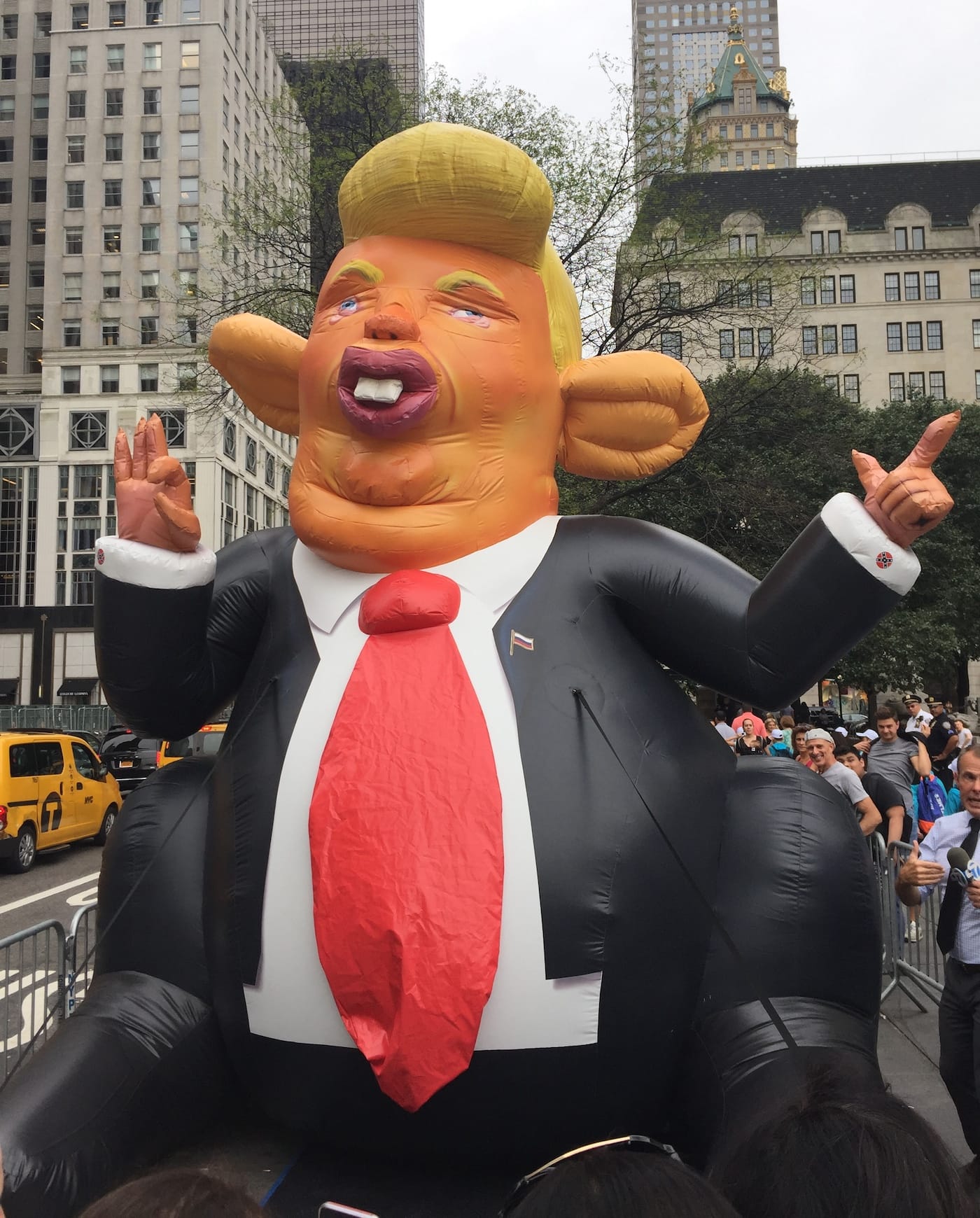Artist Jeffrey Beebe Trumpy the Rat, produced with BravinLee projects, stationed in Grand Army Plaza during the August 14 protests at Trump Tower