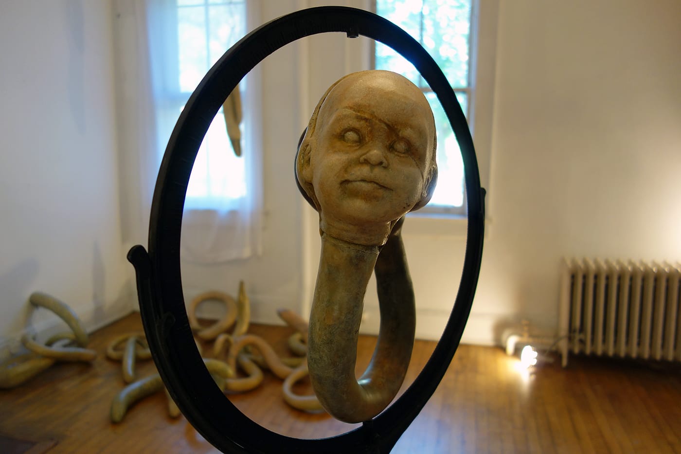 Susan Camp, "Dyad (the other side)" (2015), constrained gourds (grown in moulds), repurposed globe stand