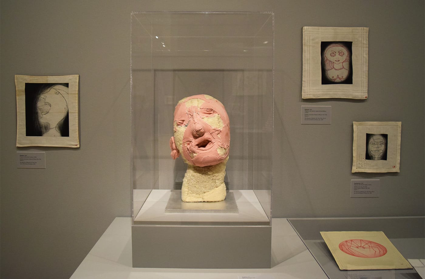 Installation view of Louise Bourgeois: An Unfolding Portrait at the Museum of Modern Art, with Louise Bourgeois, "Untitled" (1998), fabric and stainless steel at center